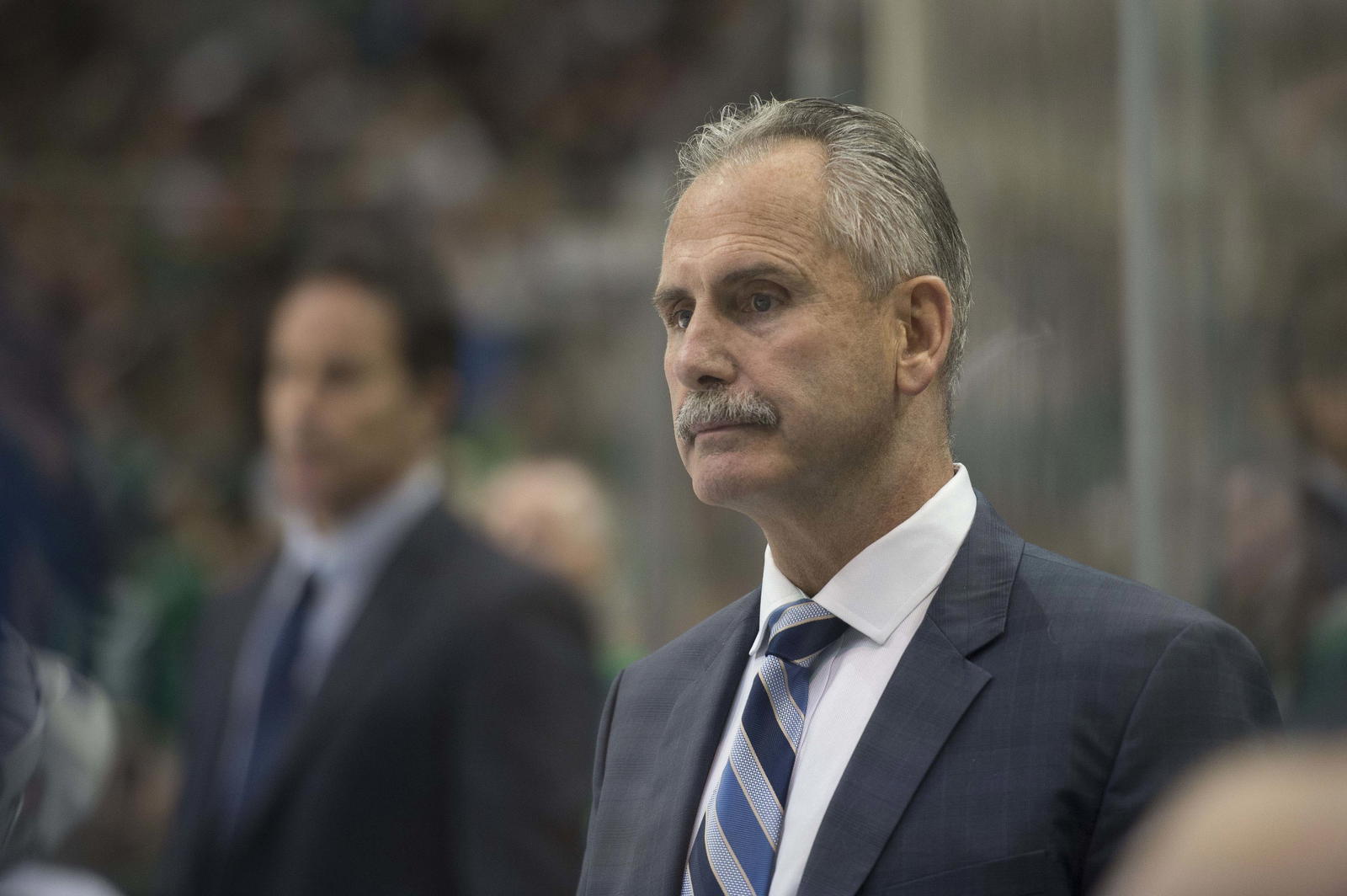 Nov 27, 2015; Dallas, TX, USA; Vancouver Canucks head coach Willie Desjardins looks on from behind the bench against the Dallas Stars during the third period at the American Airlines Center. The Stars won 3-2 in the overtime shootout. Mandatory Credit: Jerome Miron-Imagn Images