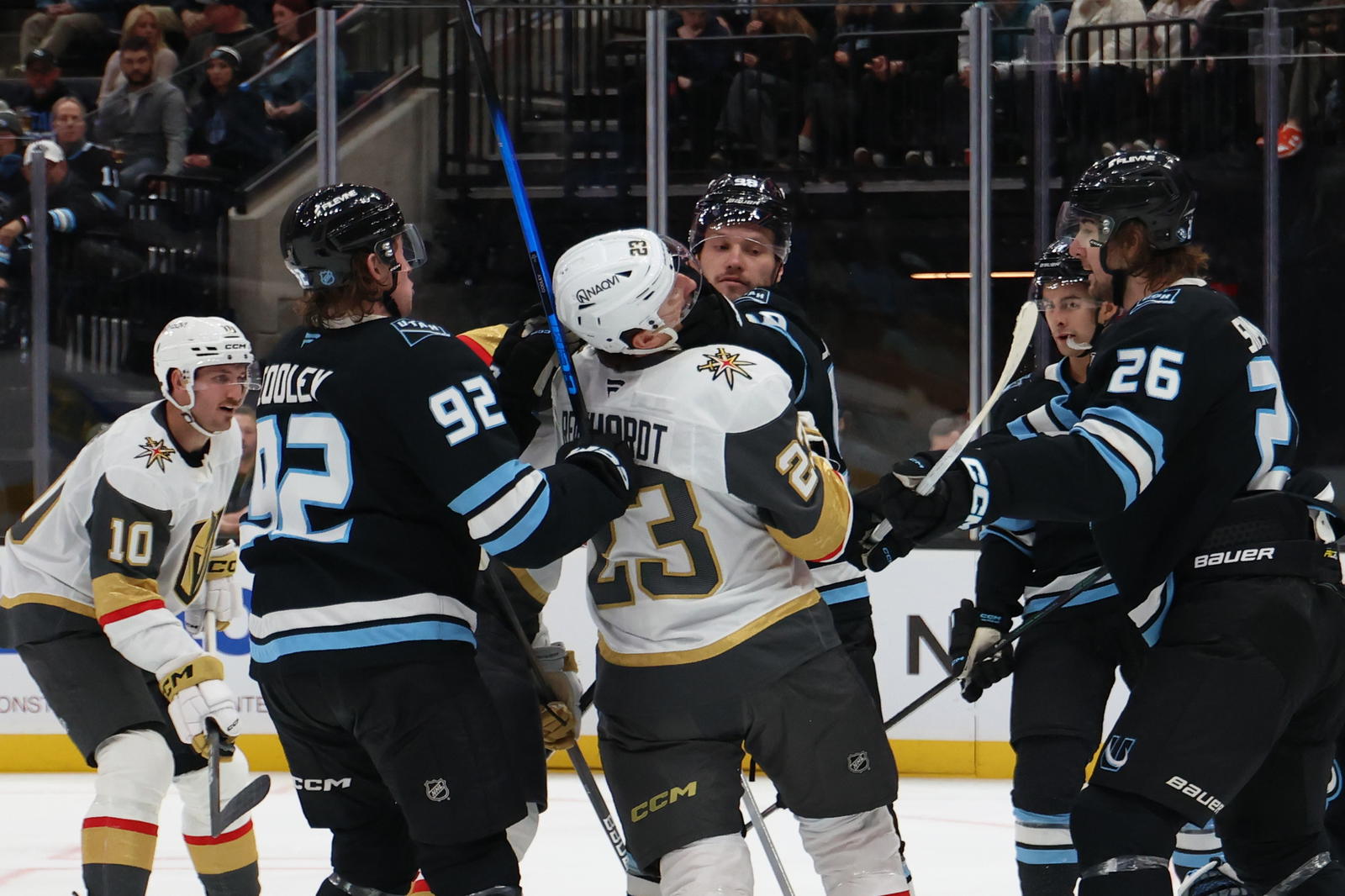 Nov 20, 2025; Salt Lake City, Utah, USA; Utah Mammoth defenseman Mikhail Sergachev (98) and Vegas Golden Knights left wing Cole Reinhardt (23) fight during the second period at Delta Center. (Rob Gray-Imagn Images).