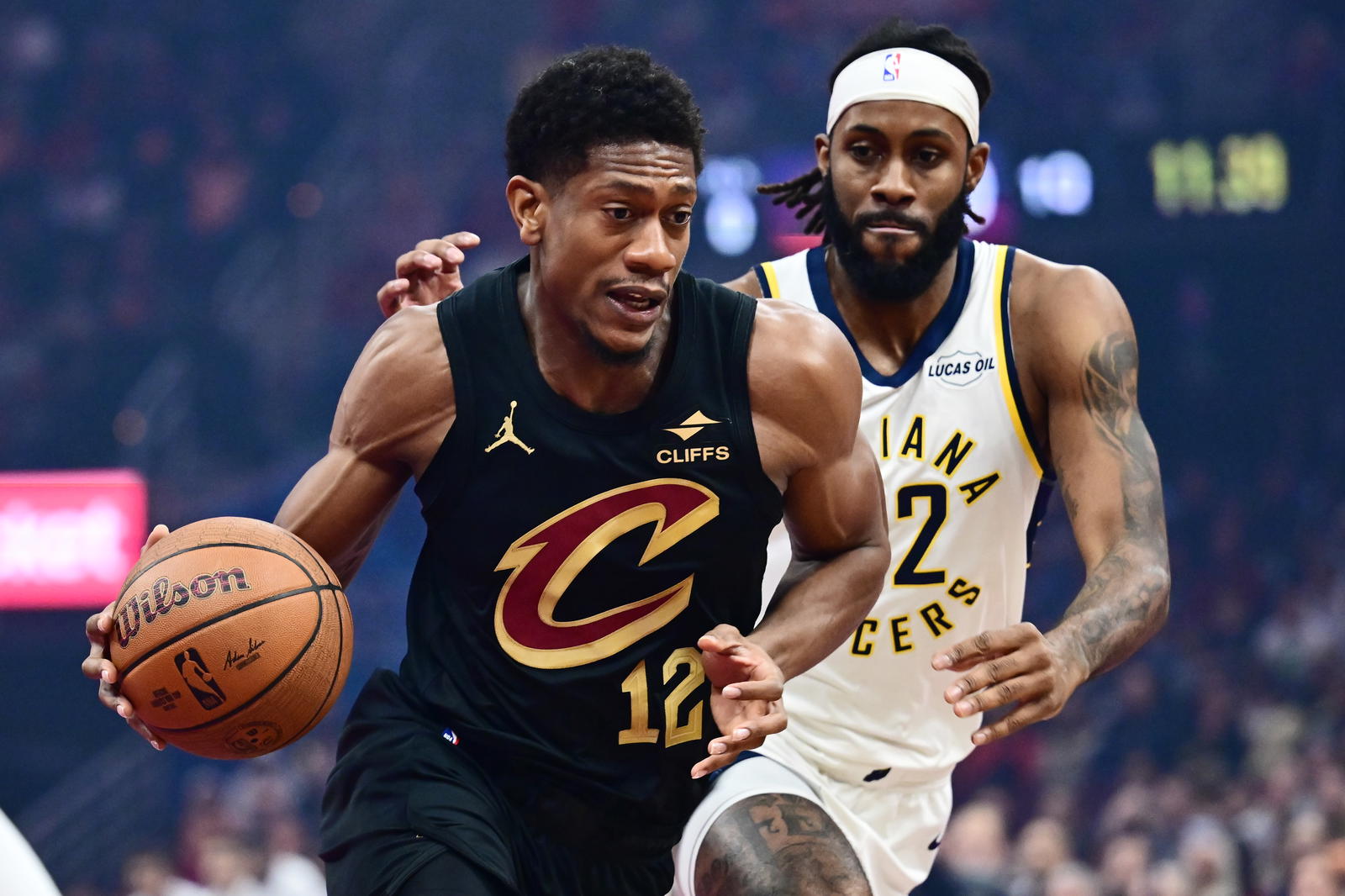 Nov 21, 2025; Cleveland, Ohio, USA; Cleveland Cavaliers forward De'Andre Hunter (12) drives to the basket against Indiana Pacers forward Isaiah Jackson (22) during the first quarter at Rocket Arena. Mandatory Credit: Ken Blaze-Imagn Images