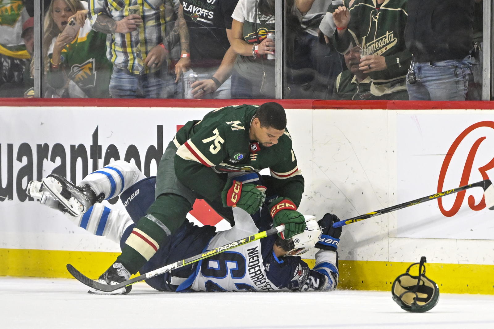 Apr 11, 2023; Saint Paul, Minnesota, USA; Minnesota Wild forward Ryan Reaves (75) and Winnipeg Jets forward Nino Niederreiter (62) were each called for roughing on this play during the third period at at Xcel Energy Center. Mandatory Credit: Nick Wosika-Imagn Images.