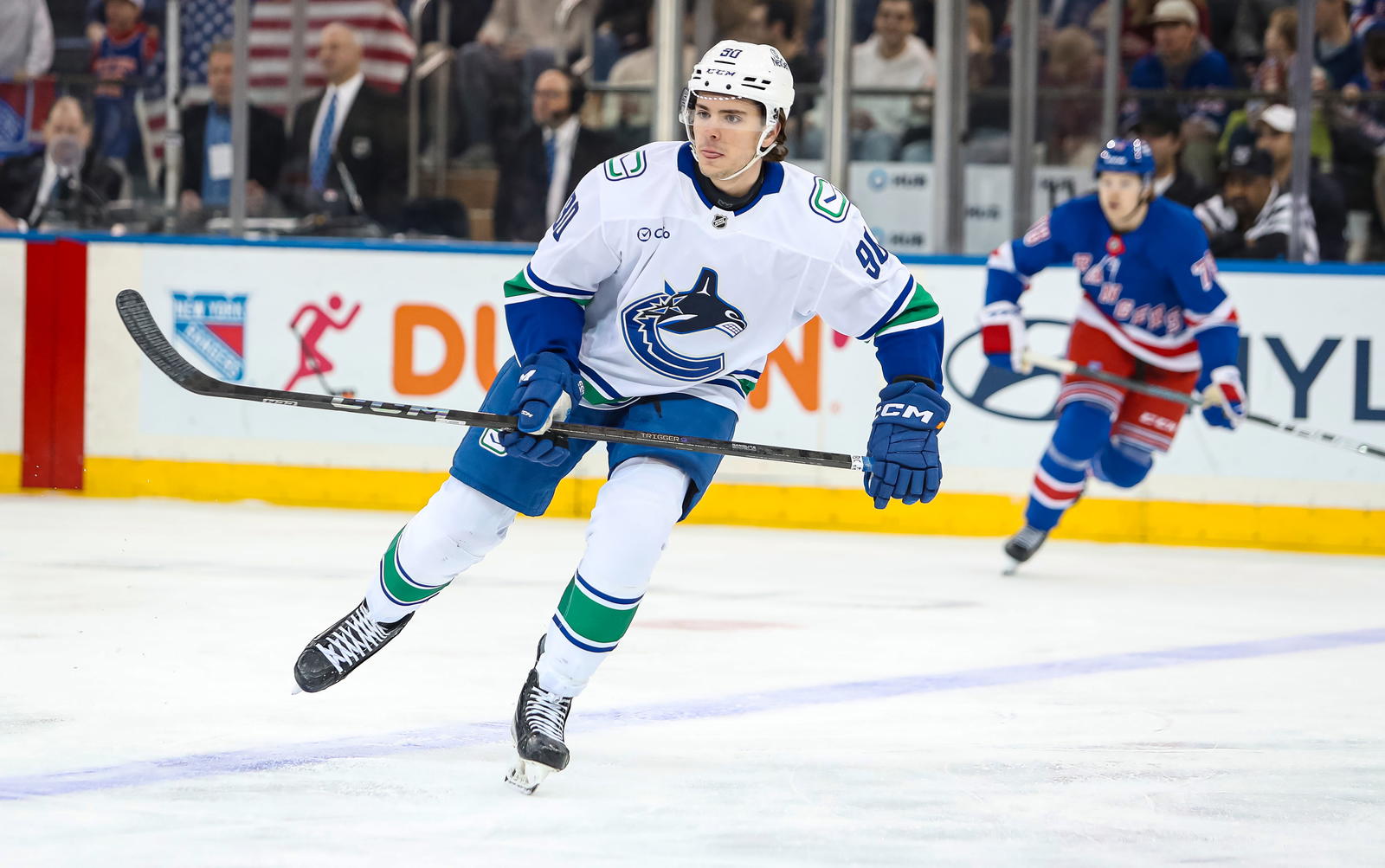 Mar 22, 2025; New York, New York, USA; Vancouver Canucks defenseman Victor Mancini (90) skates against the New York Rangers during the first period at Madison Square Garden. Mandatory Credit: Danny Wild-Imagn Images