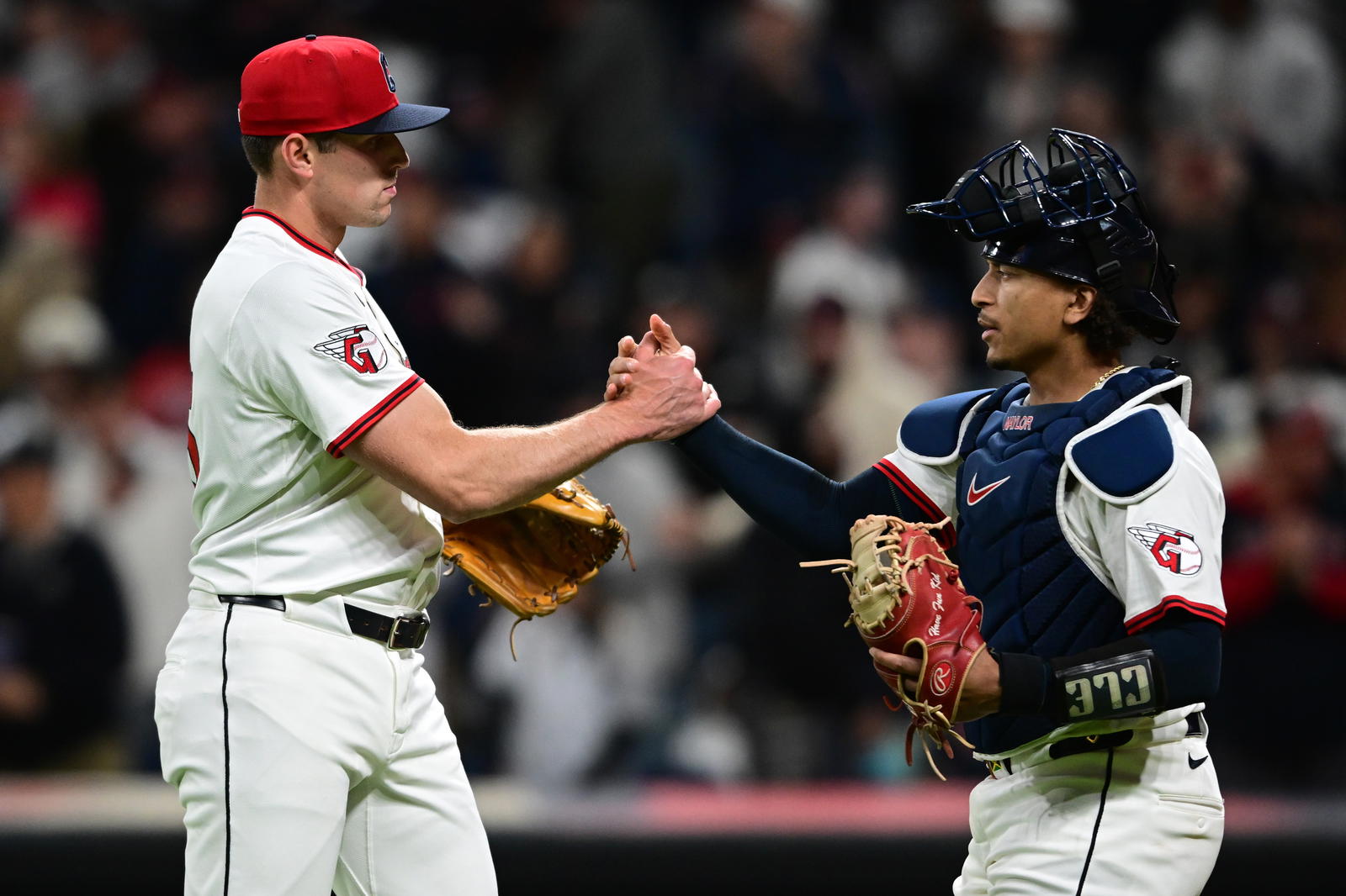 Apr 21, 2025; Cleveland, Ohio, USA; Cleveland Guardians relief pitcher Cade Smith (36) is congratulated by catcher Bo Naylor (23) after the Cleveland Guardians defeated the New York Yankees at Progressive Field. Mandatory Credit: David Dermer-Imagn Images