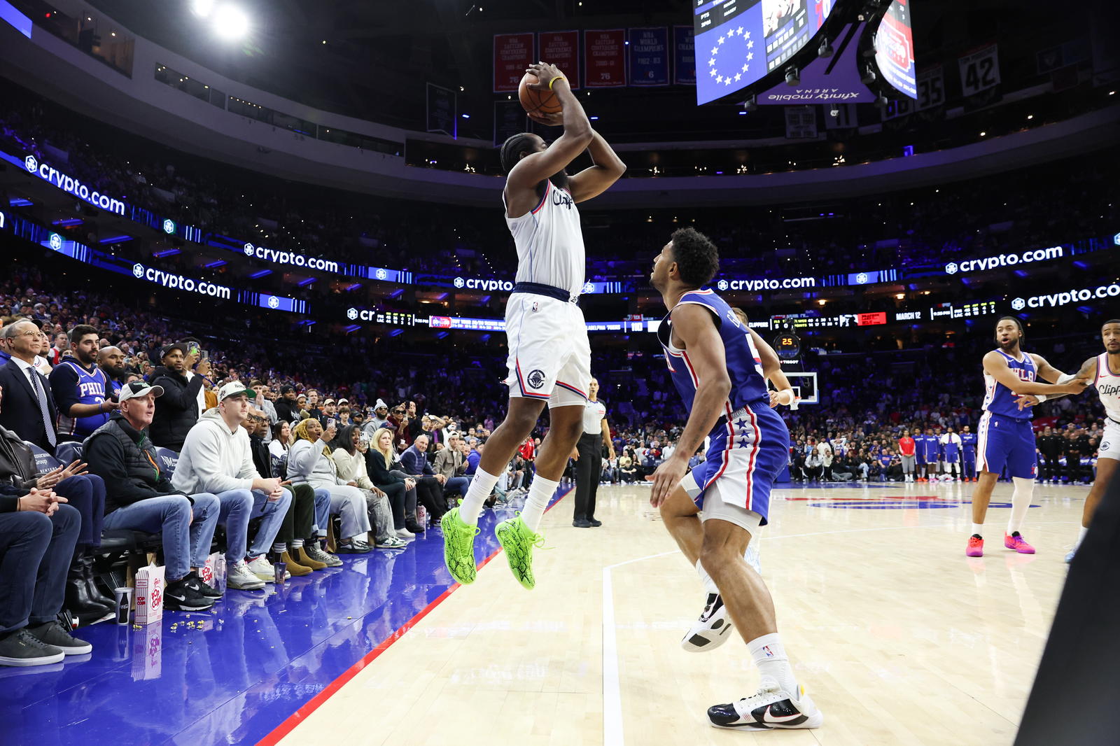 LA Clippers guard James Harden (1) attempts an unsuccessful three pointer in front of Philadelphia 76ers guard Quentin Grimes (5) during the fourth quarter at Xfinity Mobile Arena.&nbsp;Bill Streicher-Imagn Images