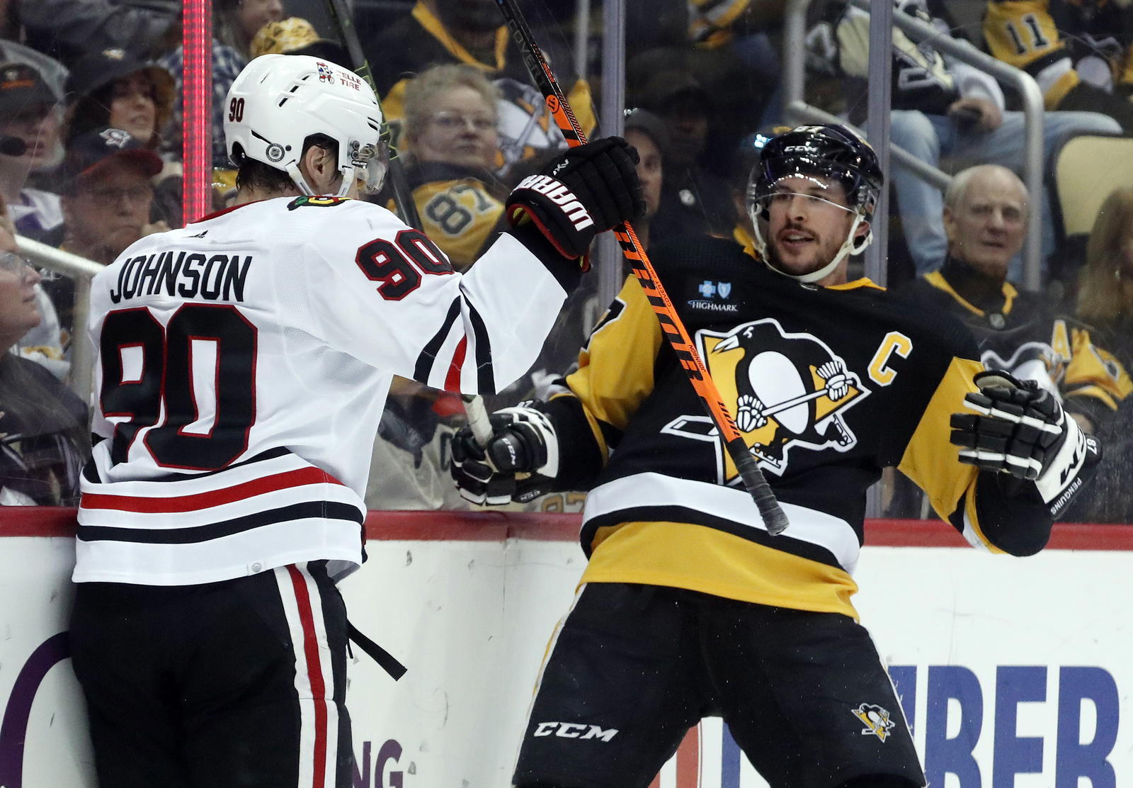 Apr 11, 2023; Pittsburgh, Pennsylvania, USA; aChicago Blackhawks center Tyler Johnson (90) collides with Pittsburgh Penguins center Sidney Crosby (87) after Johnson scored a goal against the Penguins during the third period at PPG Paints Arena. Chicago won 5-2. Mandatory Credit: Charles LeClaire-Imagn Images