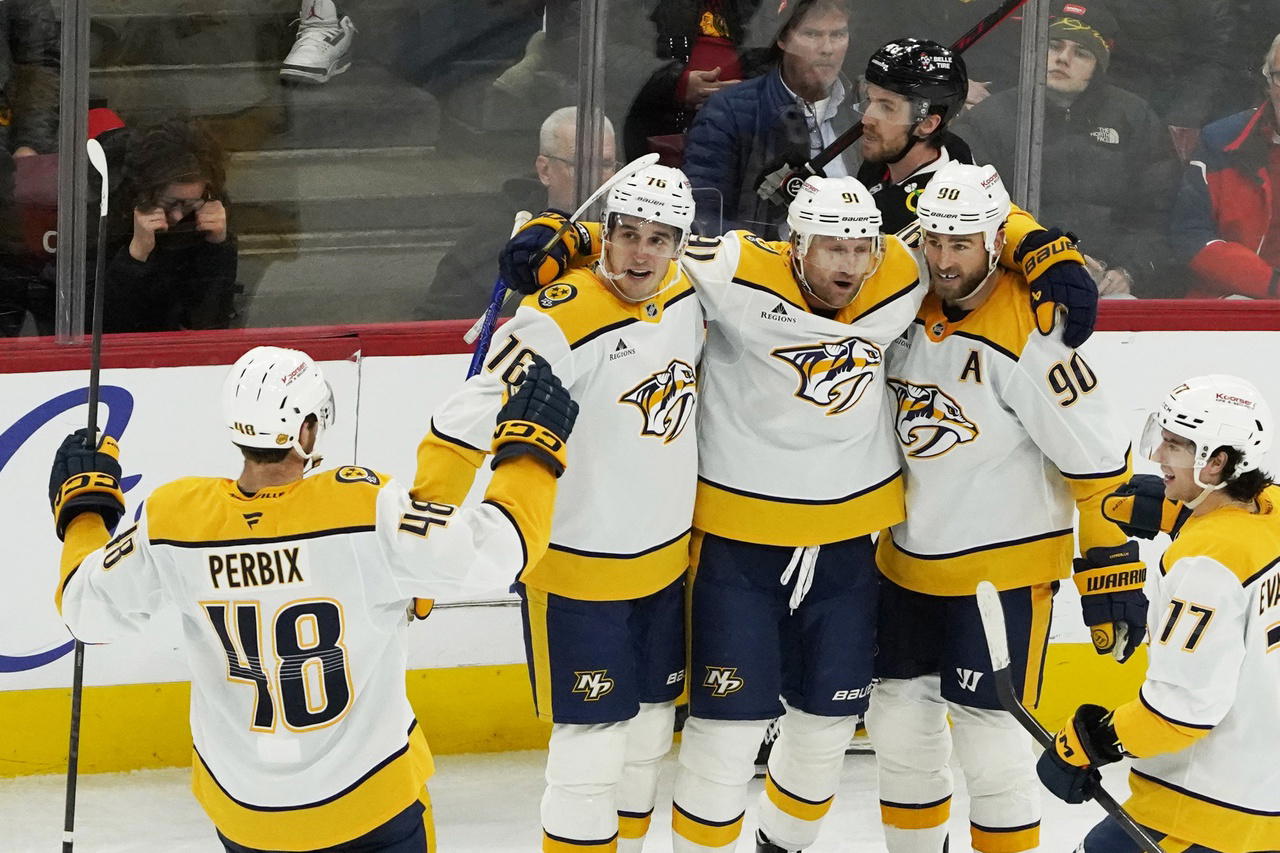 Nov 28, 2025; Chicago, Illinois, USA; Nashville Predators center Ryan O'Reilly (90) celebrates his goal against the Chicago Blackhawks with his teammates during the third period at United Center. David Banks-Imagn Images