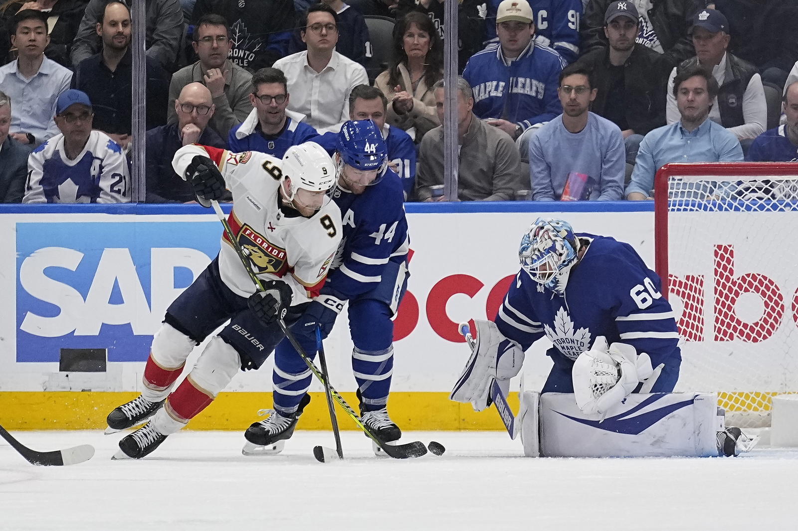 May 5, 2025; Toronto, Ontario, CAN; Florida Panthers forward Sam Bennett (9) shoots at Toronto Maple Leafs goaltender Joseph Woll (60) as defenseman Morgan Rielly (44) defends during the third period of the second round of the 2025 Stanley Cup Playoffs at Scotiabank Arena. (John E. Sokolowski-Imagn Images)