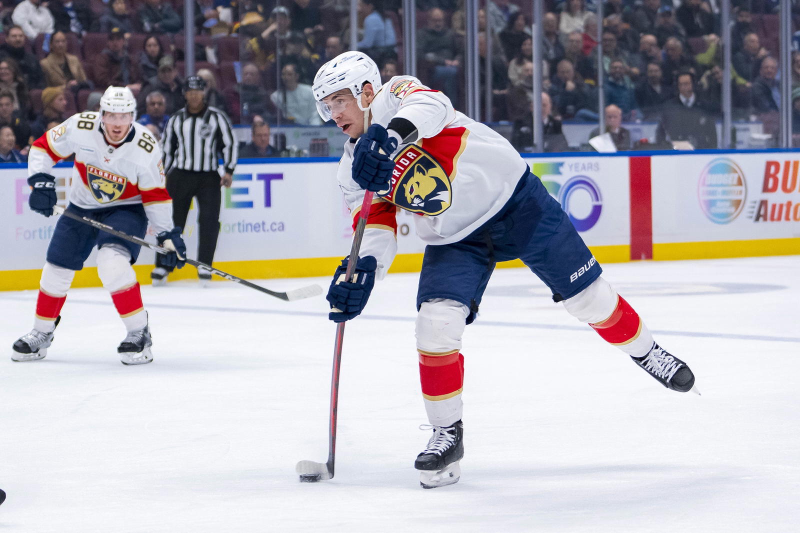 Florida Panthers forward Evan Rodrigues (17) shoots against the Vancouver Canucks during the first period at Rogers Arena. Mandatory Credit: Bob Frid-Imagn Images