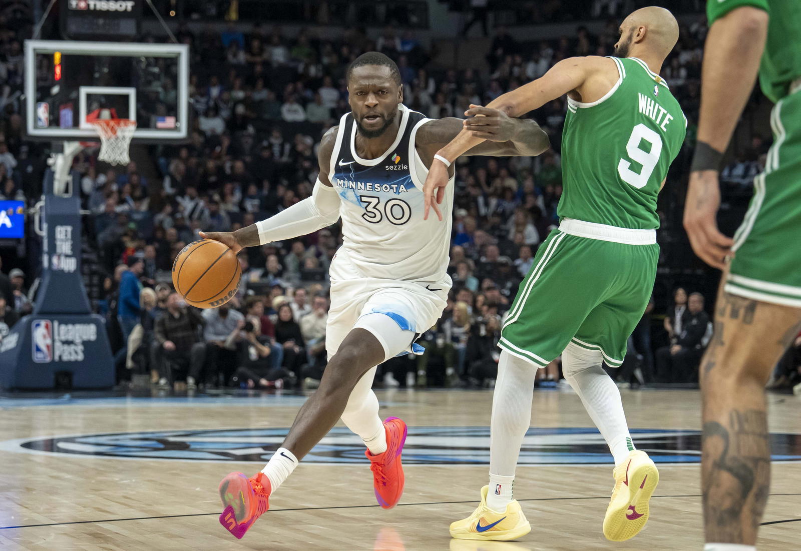 Minnesota Timberwolves forward Julius Randle (30) drives past Boston Celtics guard Derrick White (9) in the second half at Target Center.&nbsp;Jesse Johnson-Imagn Images