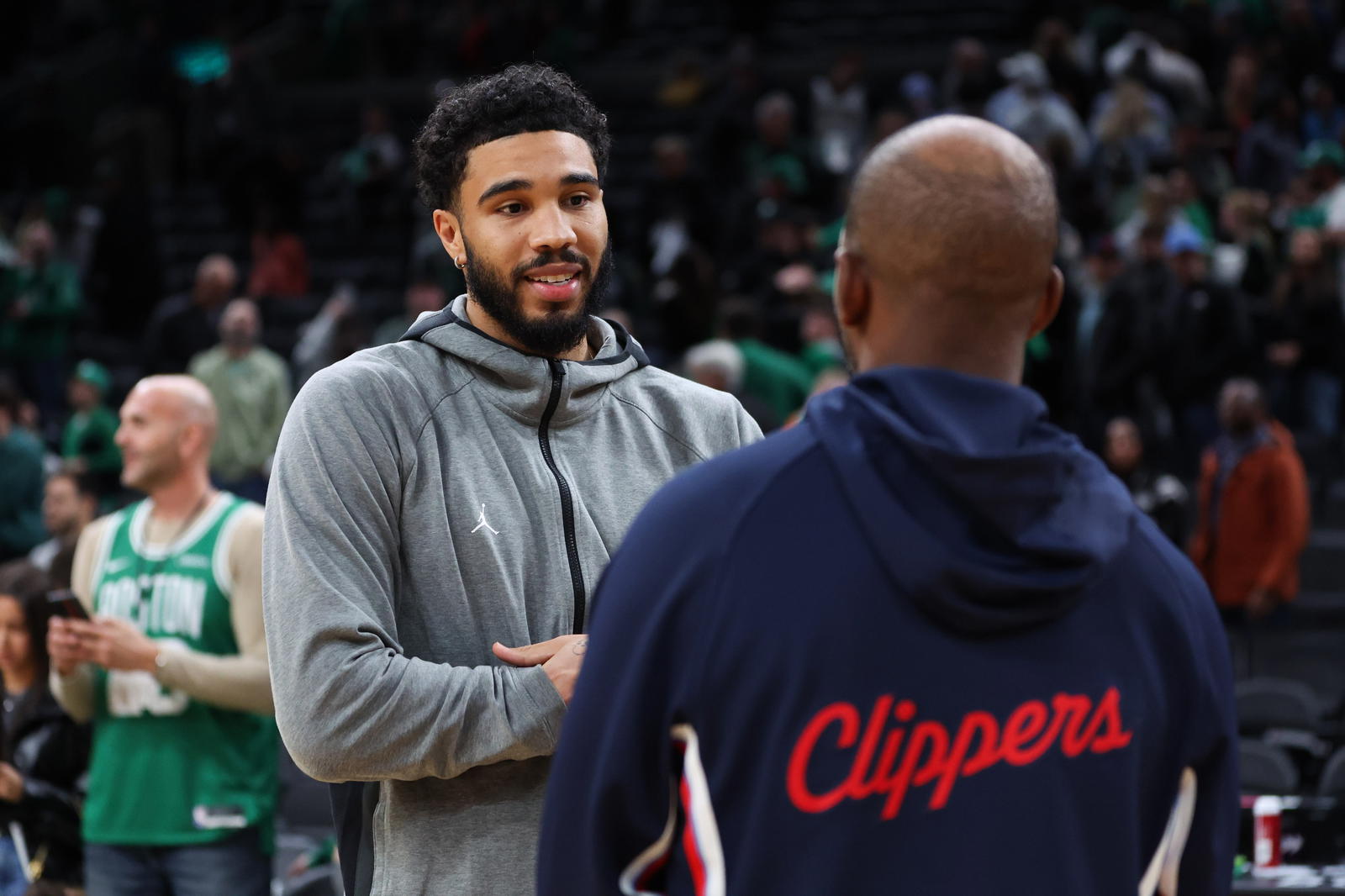 Nov 16, 2025; Boston, Massachusetts, USA; Boston Celtics forward Jayson Tatum (0) speaks with Los Angeles Clippers guard Chris Paul (3) after a game at TD Garden. (Paul Rutherford/Imagn Images)
