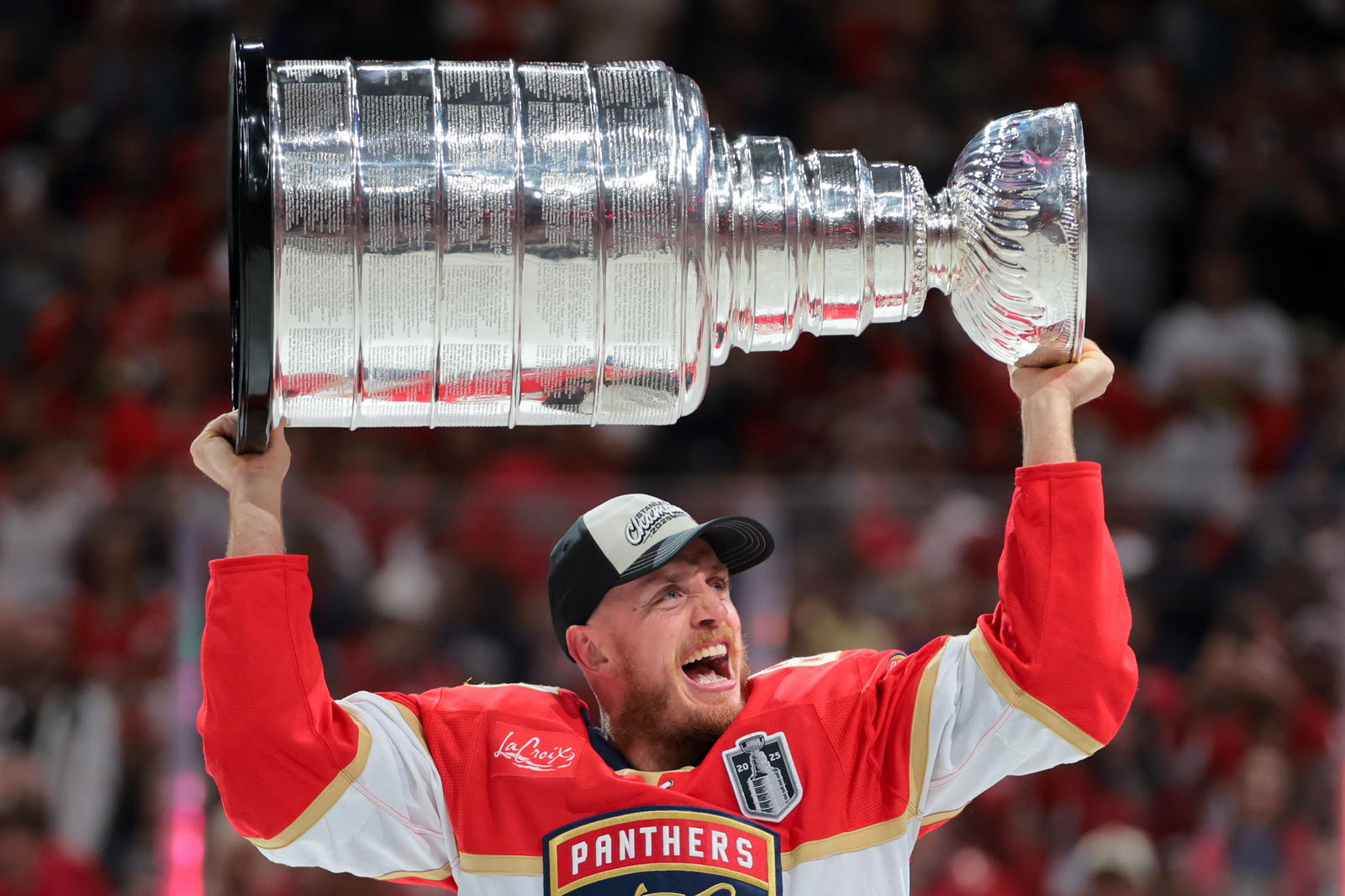 Jun 17, 2025; Sunrise, Florida, USA; Florida Panthers defenseman Nate Schmidt (88) hoists the Stanley Cup after winning game six of the 2025 Stanley Cup Final against the Edmonton Oilers at Amerant Bank Arena. Mandatory Credit: Sam Navarro-Imagn Images
