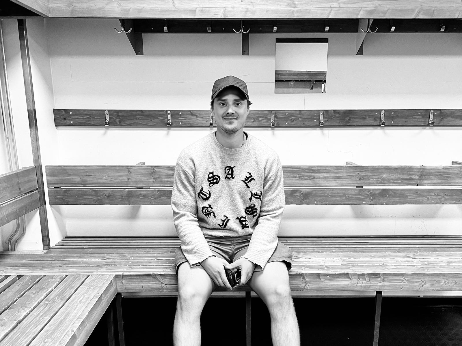 Sebastian Aho sits in the empty locker room of Oulu Ice Hall.