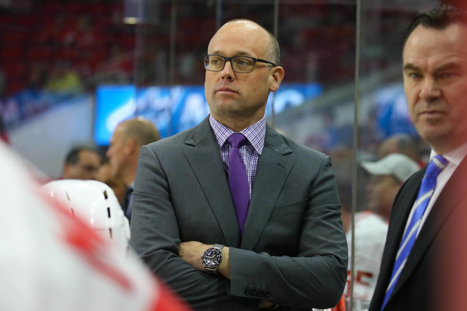 Detroit Red Wings head coach Jeff Blashill looks on form behind the bench against the Carolina Hurricanes at PNC Arena. The Detroit Red Wings defeated the Carolina Hurricanes 4-3 in overtime. Mandatory Credit: James Guillory-Imagn Images