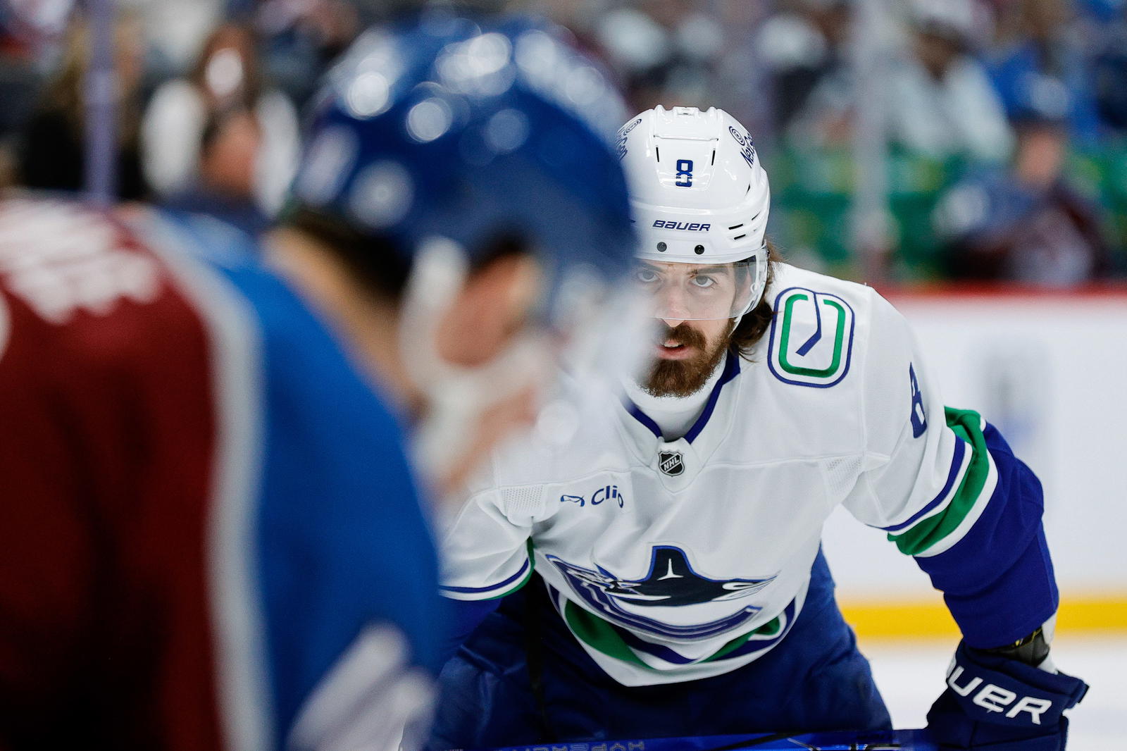 Apr 10, 2025; Denver, Colorado, USA; Vancouver Canucks right wing Conor Garland (8) looks on against Colorado Avalanche center Charlie Coyle (10) in the first period at Ball Arena. Mandatory Credit: Isaiah J. Downing-Imagn Images
