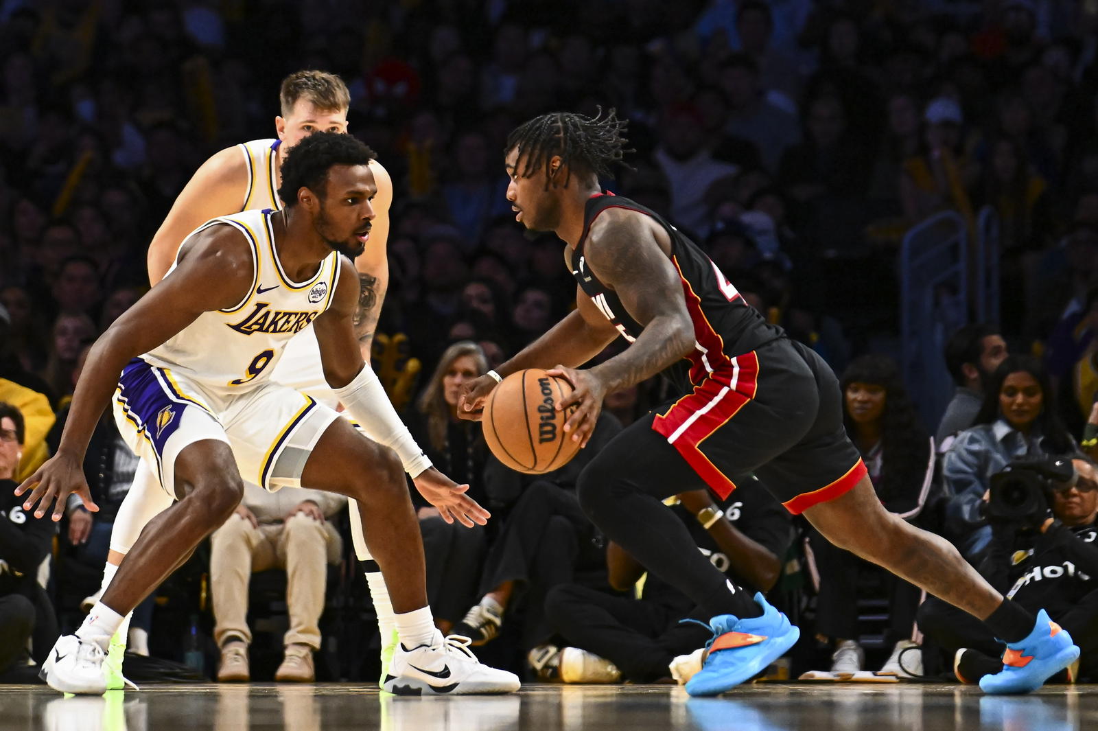 Los Angeles Lakers guard Bronny James (9) defends against Miami Heat guard Davion Mitchell (45) during the second half at Crypto.com Arena.&nbsp;Jonathan Hui-Imagn Images