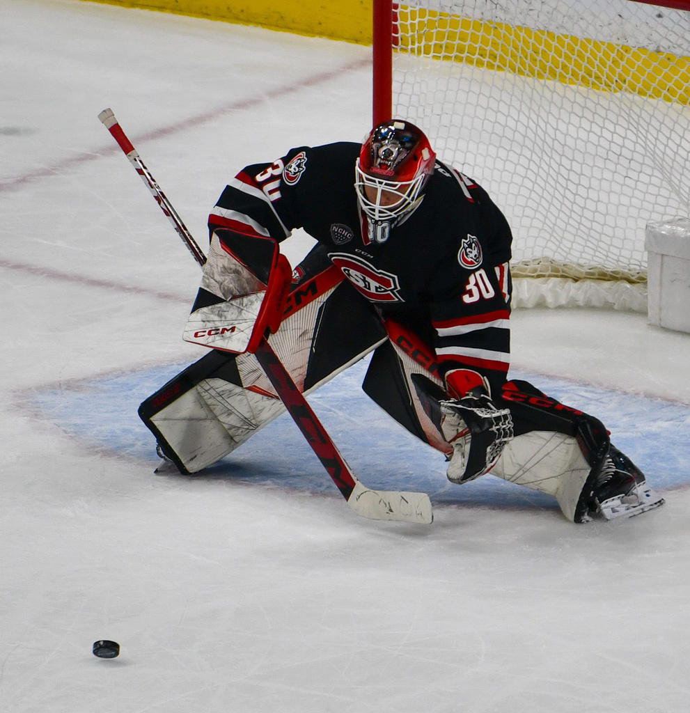 St. Cloud State men's hockey goalie Isak Posch stops the puck with his stick March 22, 2024 in the NCHC Frozen Faceoff at the Xcel Energy Center. The Huskies lost the semifinal game 5-4 to Denver.&nbsp;© Reid Glenn / USA TODAY NETWORK