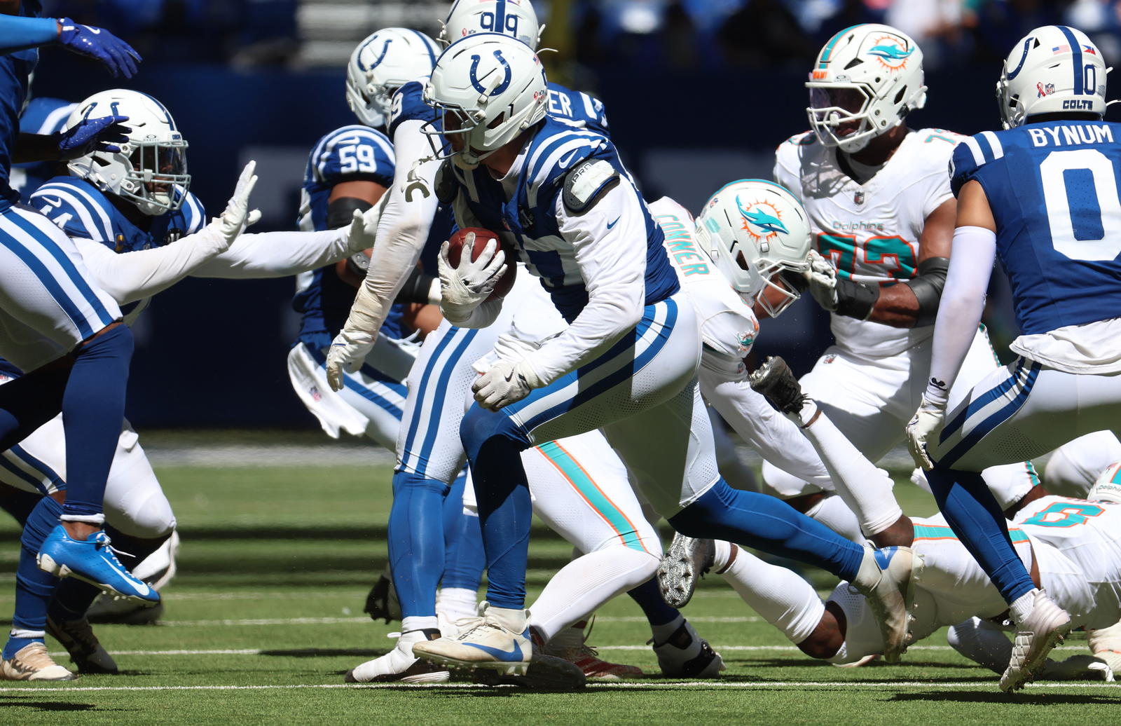 Indianapolis Colts defensive end Laiatu Latu (97) returns an interception during the second half against the Miami Dolphins at Lucas Oil Stadium. Mandatory Credit: Trevor Ruszkowski-Imagn Images