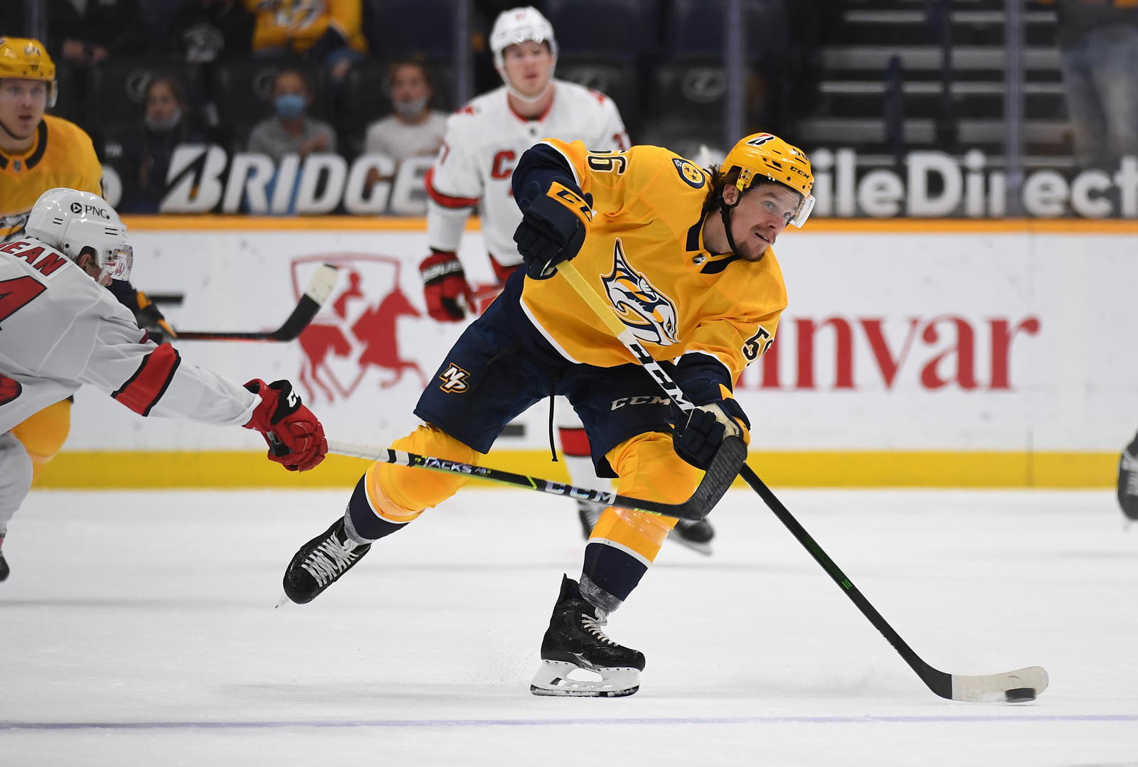 May 8, 2021; Nashville, Tennessee, USA; Nashville Predators left wing Erik Haula (56) scores an empty net goal during the third period against the Carolina Hurricanes at Bridgestone Arena. Mandatory Credit: Christopher Hanewinckel-Imagn Images