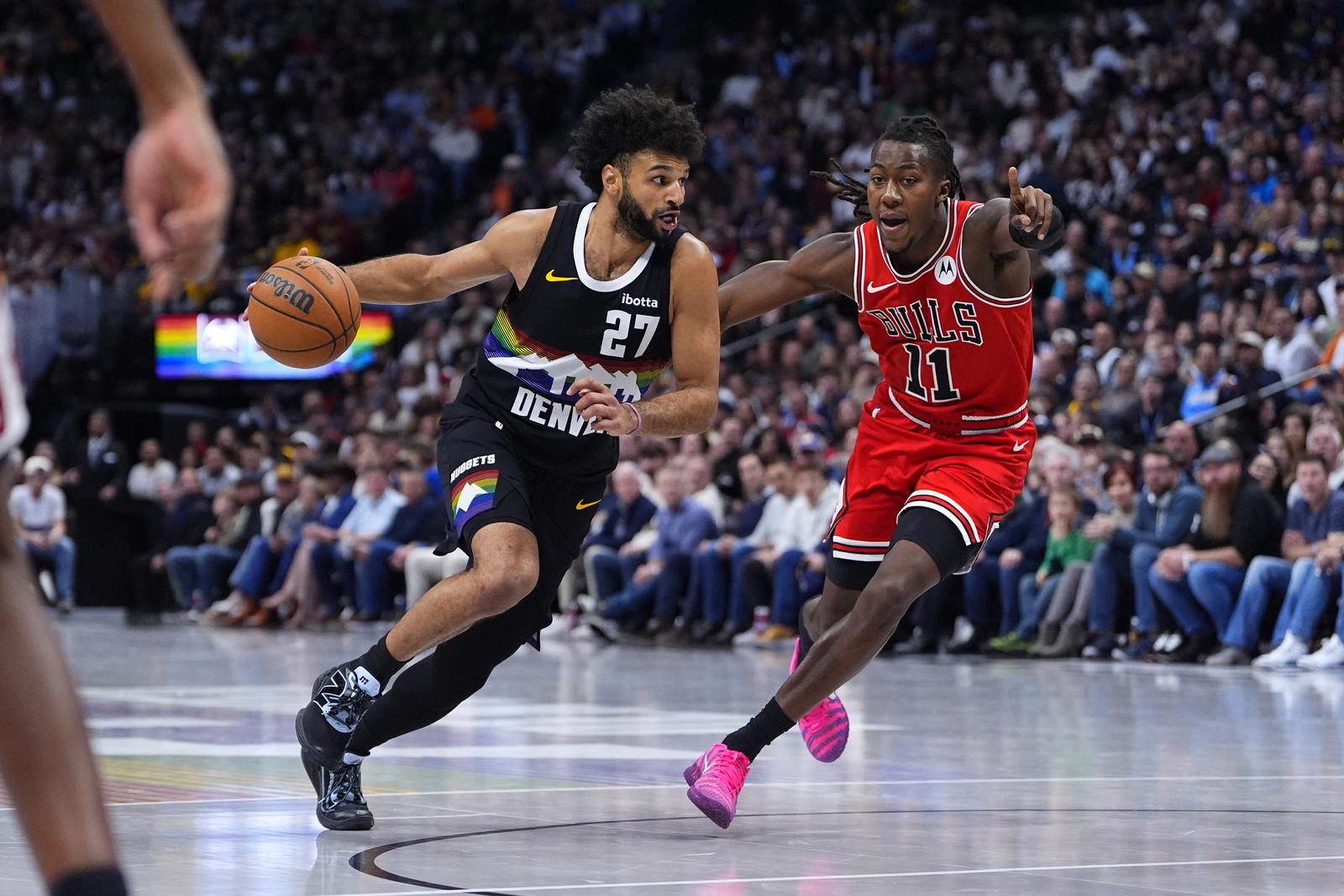 Denver Nuggets guard Jamal Murray (27) drives past Chicago Bulls guard Ayo Dosunmu (11) in the second half at Ball Arena.&nbsp;Ron Chenoy-Imagn Images