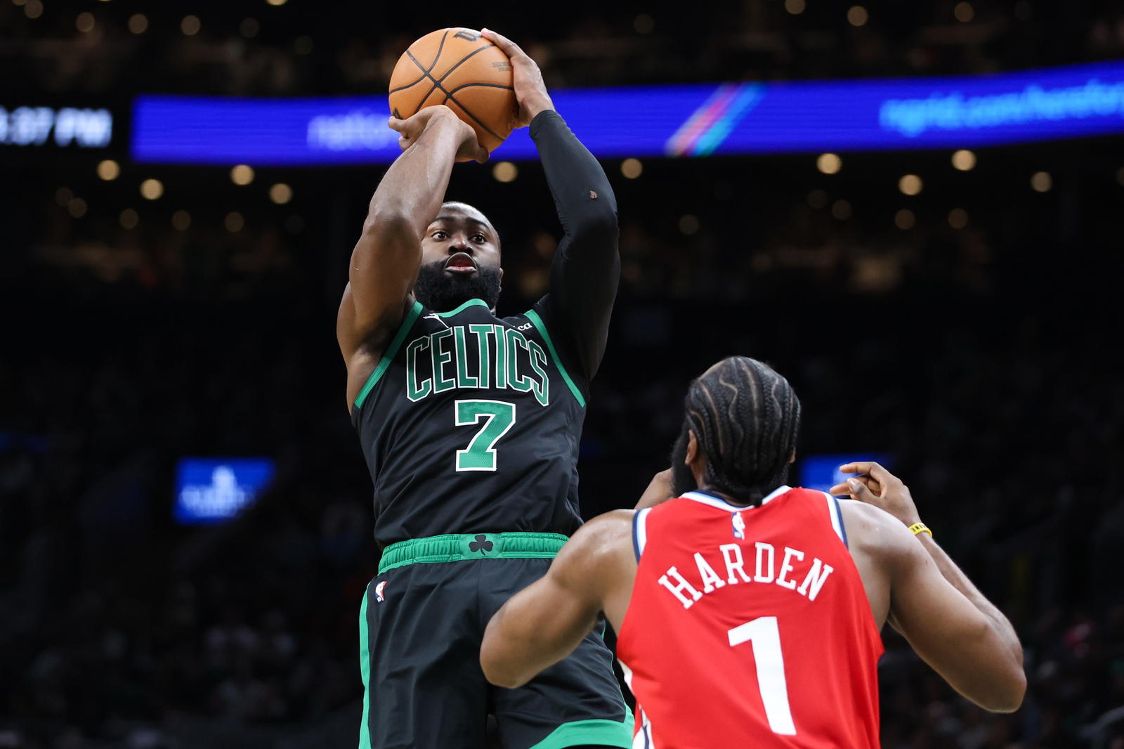 Nov 16, 2025; Boston, Massachusetts, USA; Boston Celtics forward Jaylen Brown (7) shoots during the first half defended by Los Angeles Clippers guard James Harden (1) at TD Garden. (Paul Rutherford/Imagn Images)