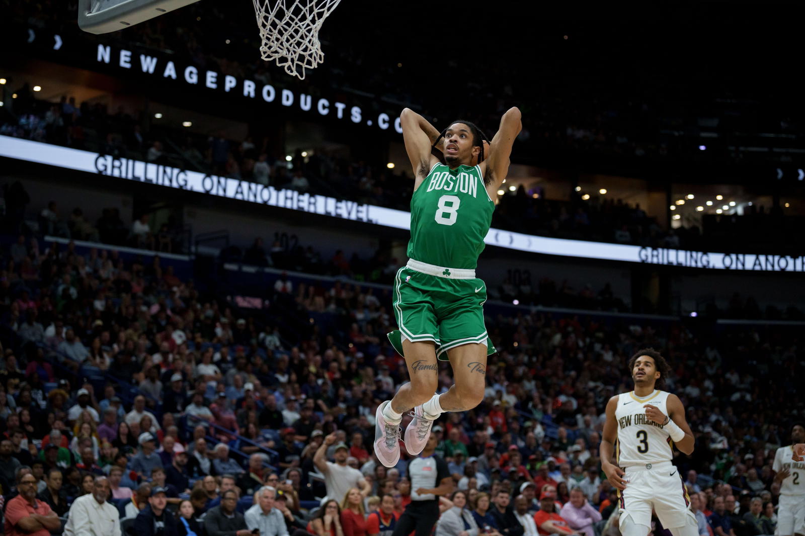 Oct 27, 2025; New Orleans, Louisiana, USA; Boston Celtics forward Josh Minott (8) goes up for a dunk against the New Orleans Pelicans during the first half at Smoothie King Center. (Matthew Hinton/Imagn Images)
