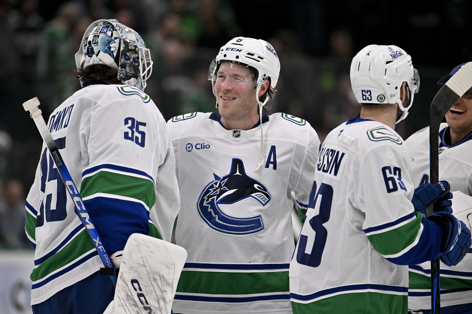 Thatcher Demko, Brock Boeser, Max Sasson and Kevin Lankinen (Jerome Miron-Imagn Images)