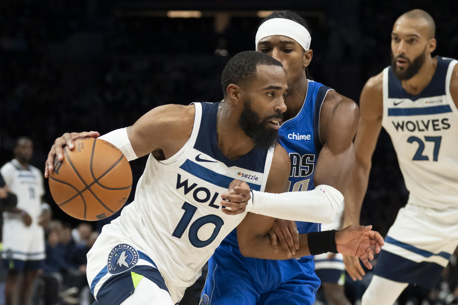 Minnesota Timberwolves guard Mike Conley (10) drives to the basket past Dallas Mavericks guard Brandon Williams (10) in the second half at Target Center. Jesse Johnson-Imagn Images