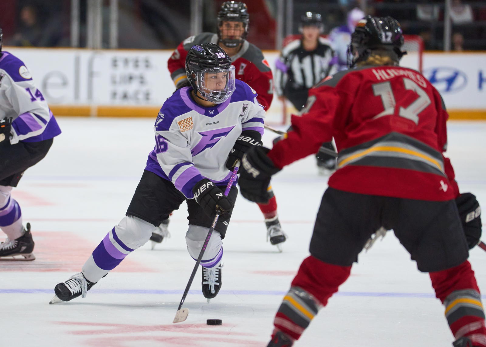 Sophie Jaques carries the puck across the offensive blueline for the Minnesota Frost -&nbsp;Photo @ Ellen Bond