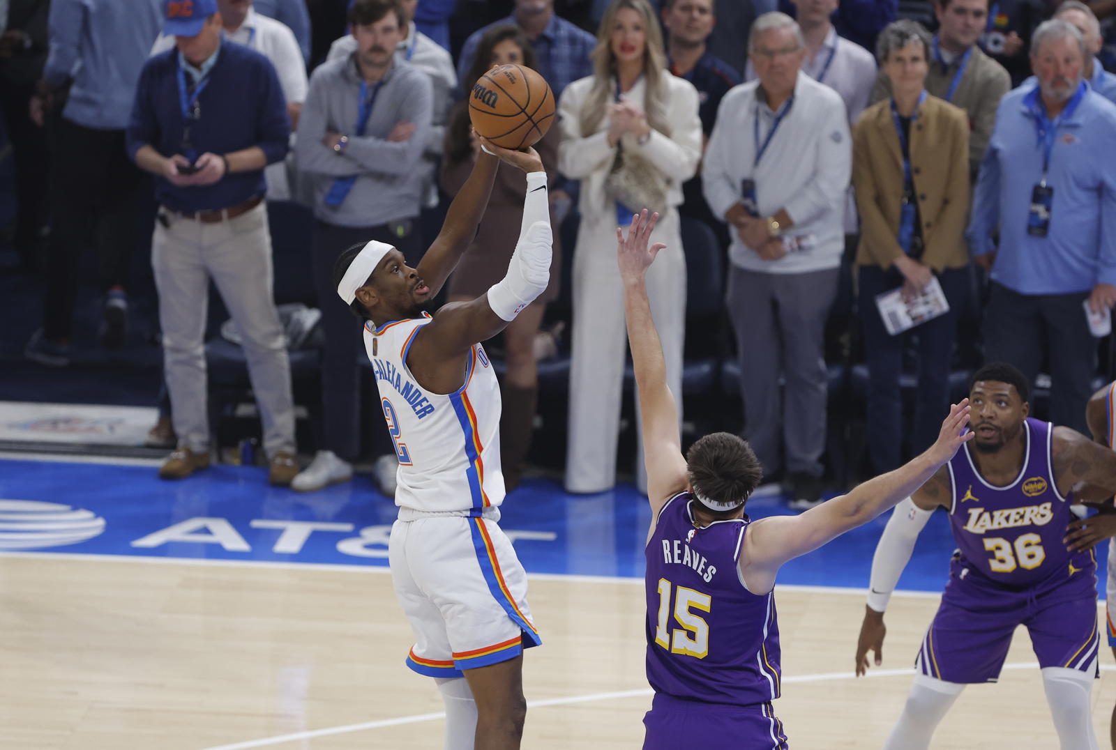 Nov 12, 2025; Oklahoma City, Oklahoma, USA; Oklahoma City Thunder guard Shai Gilgeous-Alexander (2) shoots over Los Angeles Lakers guard Austin Reaves (15) during the first quarter at Paycom Center. Mandatory Credit: Alonzo Adams-Imagn Images