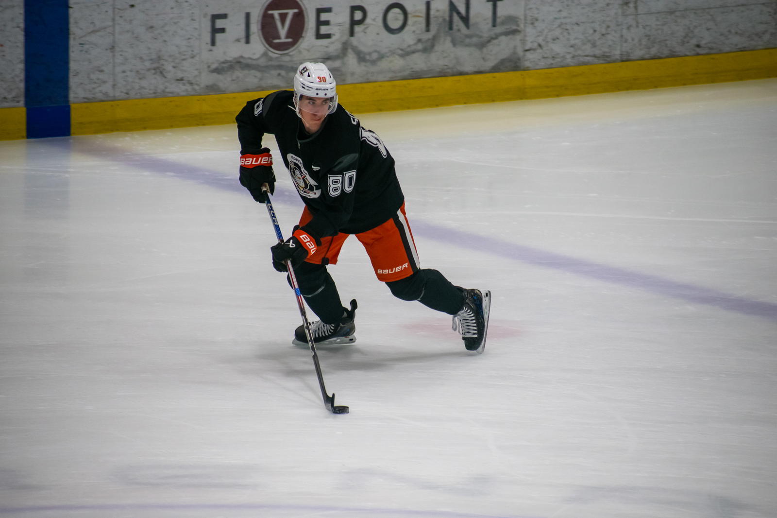 Jul 2, 2025; Irvine, California, USA; Drew Schock controls a puck during a drill at Ducks development camp at Great Park Ice. Mandatory Credit: Derek Lee-The Hockey News