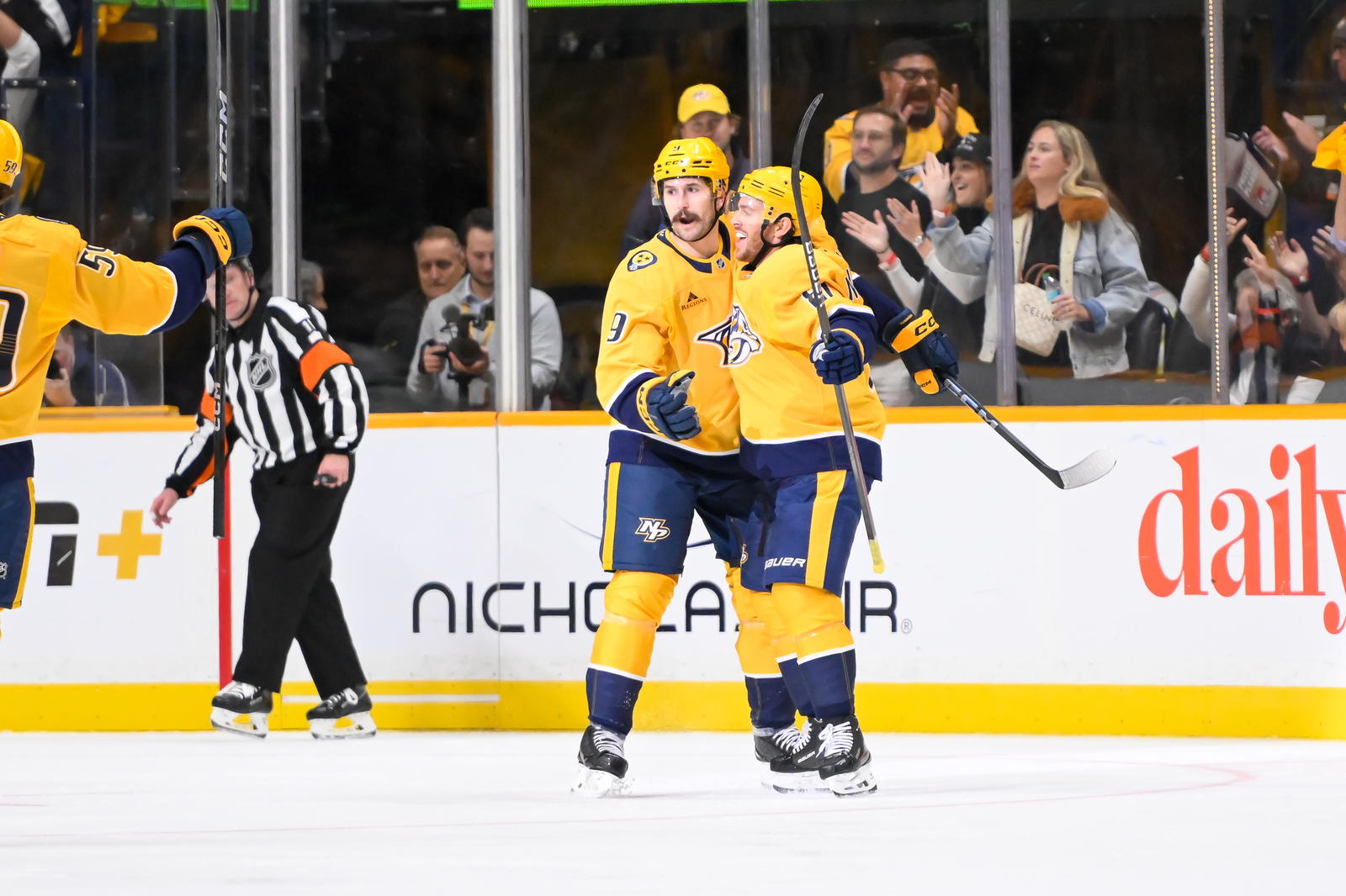 Oct 10, 2024; Nashville, Tennessee, USA; Nashville Predators left wing Filip Forsberg (9) celebrates his goal with center Jonathan Marchessault (81) during the second period at Bridgestone Arena. Mandatory Credit: Steve Roberts-Imagn Images