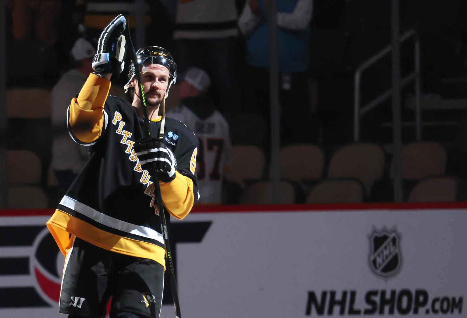 Apr 8, 2025; Pittsburgh, Pennsylvania, USA; Pittsburgh Penguins defenseman Erik Karlsson (65) reacts after being named a star of the game against the Chicago Blackhawks at PPG Paints Arena. Mandatory Credit: Charles LeClaire-Imagn Images