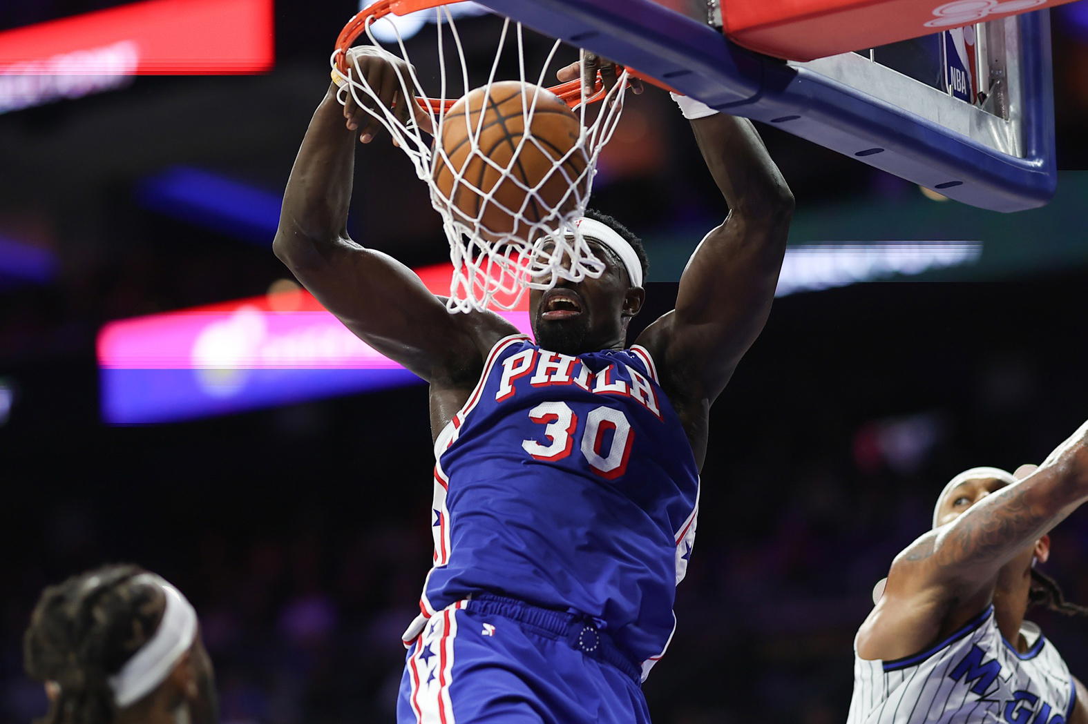 Oct 27, 2025; Philadelphia, Pennsylvania, USA; Philadelphia 76ers center Adem Bona (30) dunks the ball against the Orlando Magic during the third quarter at Xfinity Mobile Arena. Mandatory Credit: Bill Streicher-Imagn Images