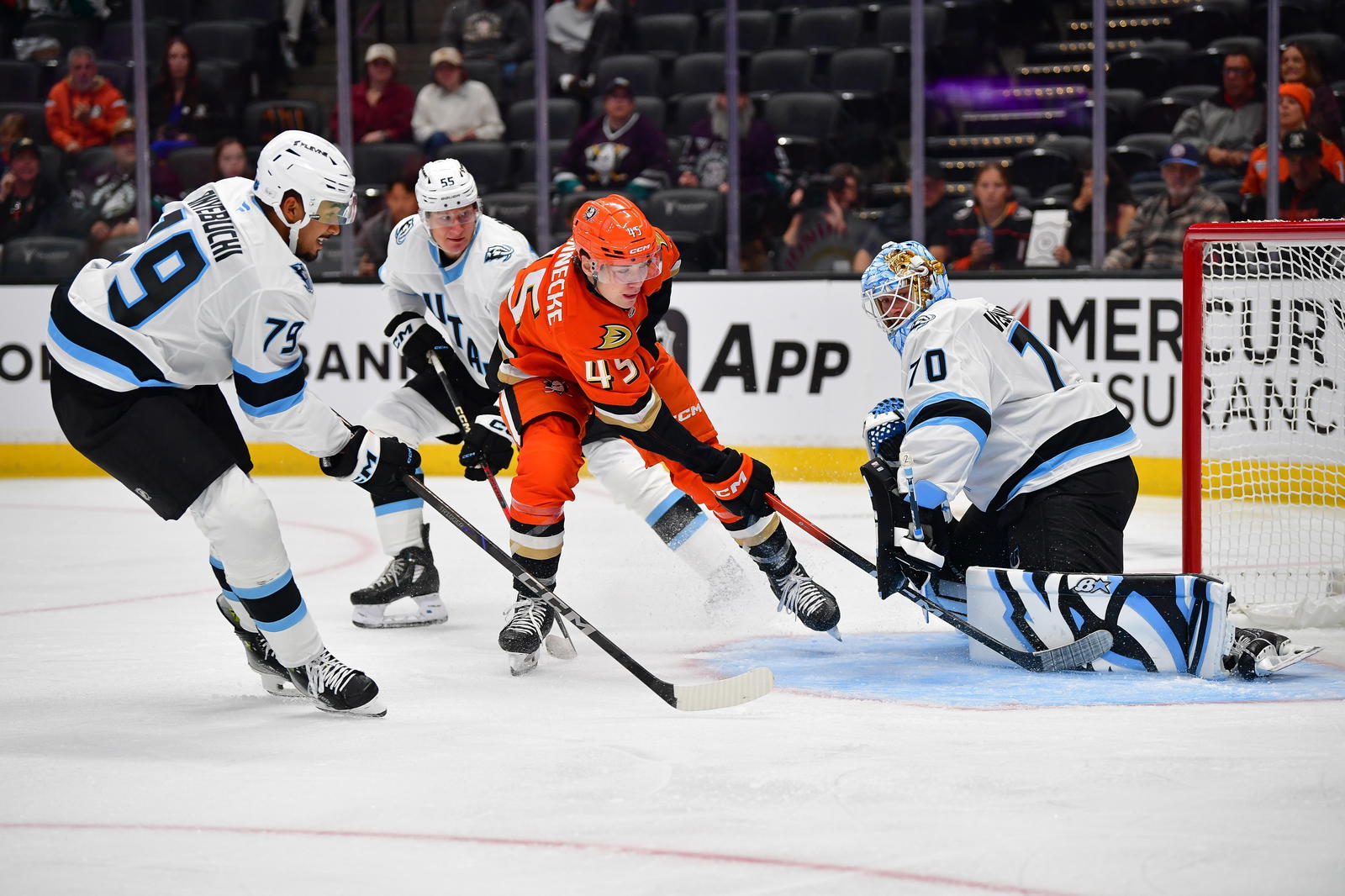 Sep 22, 2025; Anaheim, California, USA; Anaheim Ducks right wing Beckett Sennecke (45) scores a goal against Utah Mammoth goaltender Karel Vejmelka (70) during the second period at Honda Center. Mandatory Credit: Gary A. Vasquez-Imagn Images