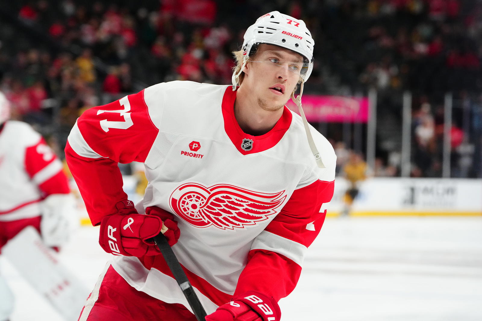 Mar 22, 2025; Las Vegas, Nevada, USA; Detroit Red Wings defenseman Simon Edvinsson (77) warms up before a game against the Vegas Golden Knights at T-Mobile Arena. (Stephen R. Sylvanie, Imagn Images)