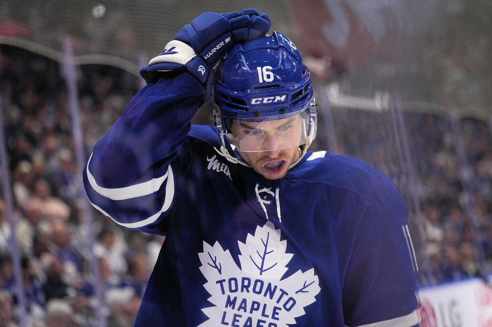 Toronto Maple Leafs forward Mitch Marner (16) adjusts his helmet after a play against the Florida Panthers during the first period of game seven of the second round of the 2025 Stanley Cup Playoffs at Scotiabank Arena. Mandatory Credit: John E. Sokolowski-Imagn Images