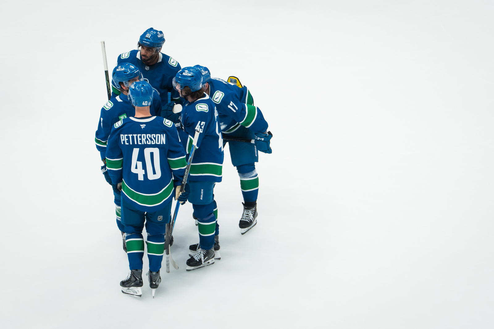 Nov 11, 2025; Vancouver, British Columbia, CAN; Vancouver Canucks forward Evander Kane (91) and forward Conor Garland (8) and forward Elias Pettersson (40) and defenseman Quinn Hughes (43) and defenseman Filip Hronek (17) talk during a stop in play against the Winnipeg Jets in the third period at Rogers Arena. Mandatory Credit: Bob Frid-Imagn Images