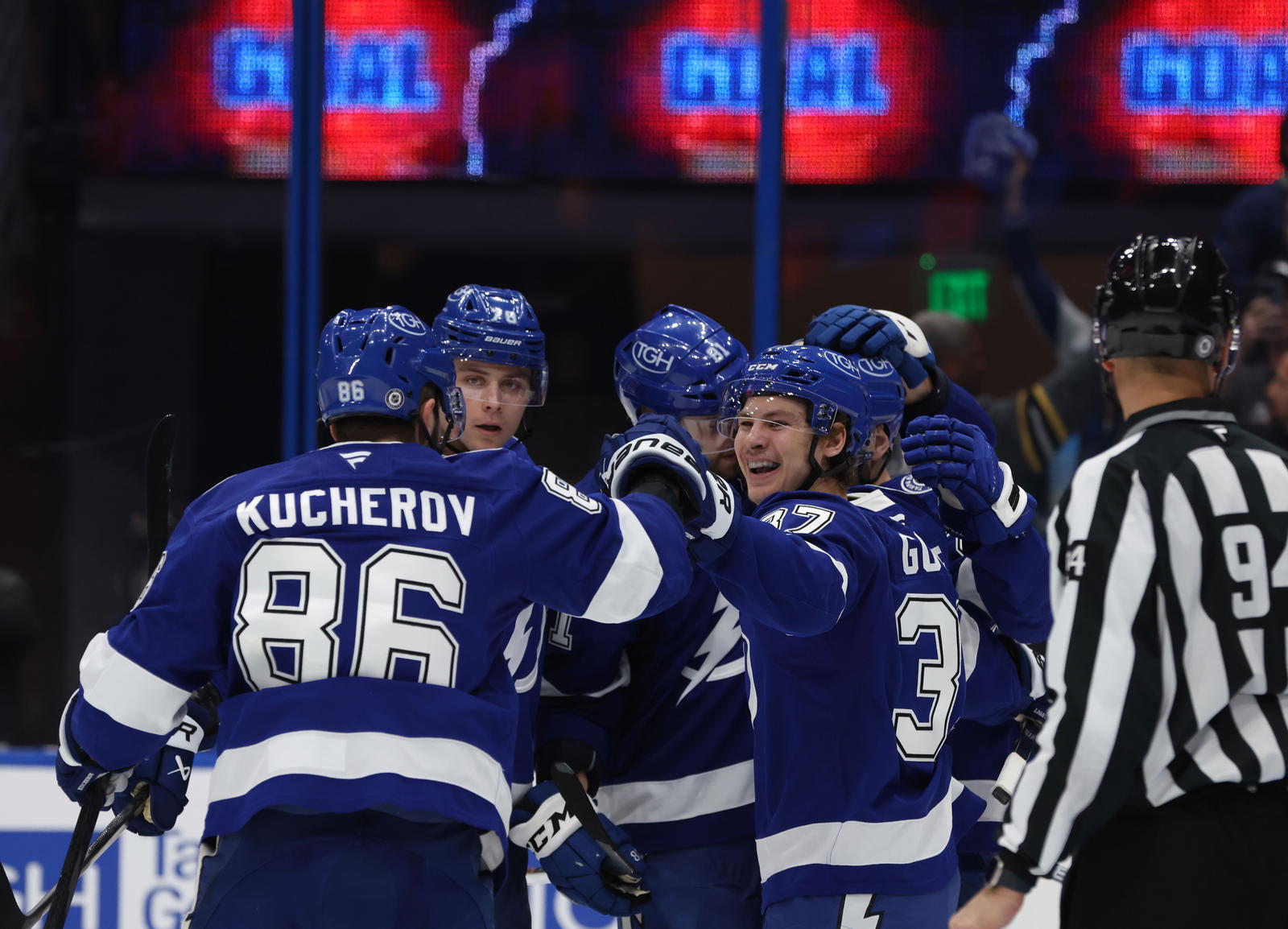 Mar 6, 2025; Tampa, Florida, USA; Tampa Bay Lightning center Yanni Gourde (37), right wing Nikita Kucherov (86), right wing Oliver Bjorkstrand (22), defenseman Emil Lilleberg (78) celebrate after they scored a goal on Buffalo Sabres during the second period at Amalie Arena. Mandatory Credit: Kim Klement Neitzel-Imagn Images
