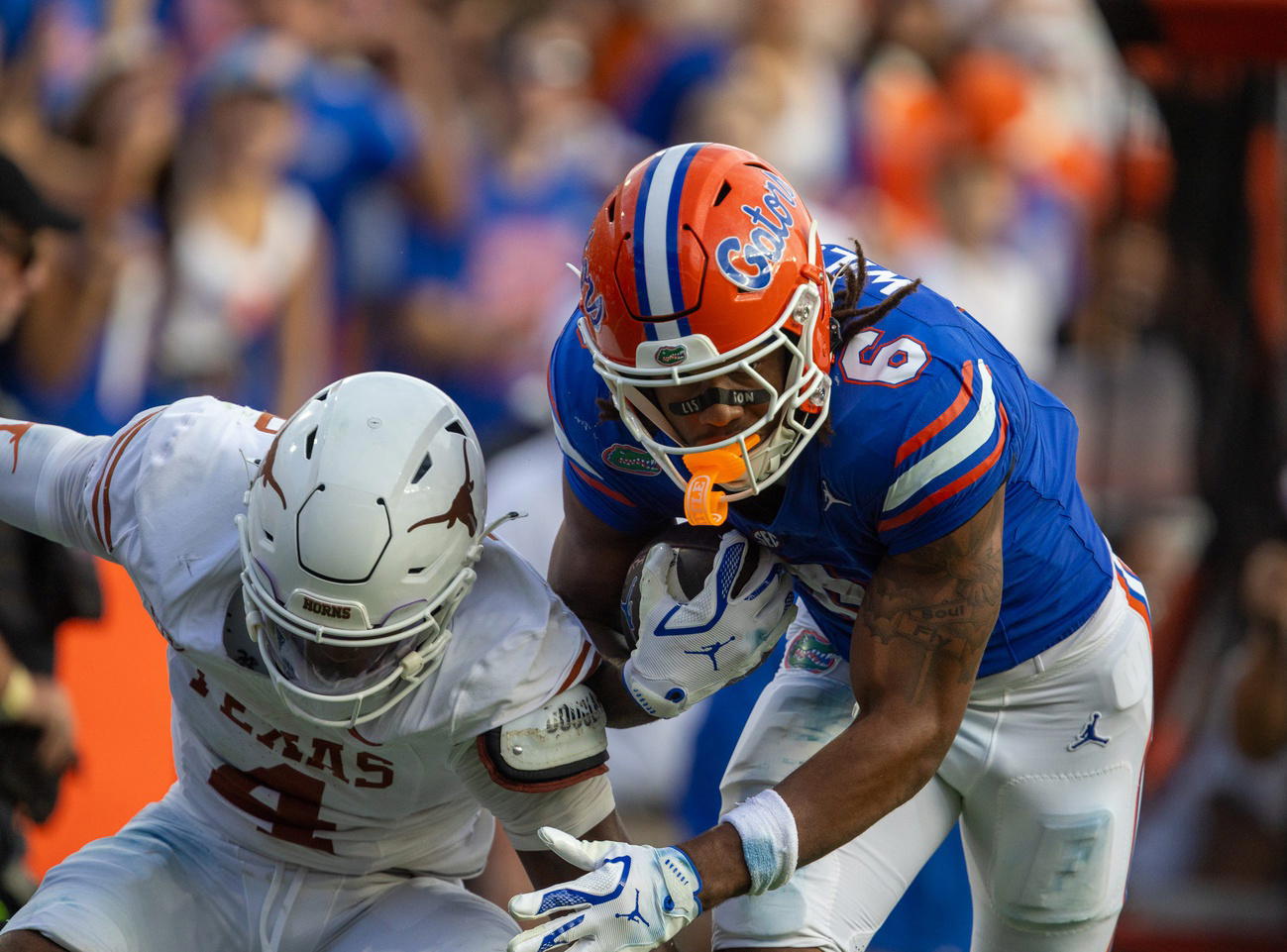 Dallas Wilson (6) became the first Florida freshman receiver to catch a touchdown pass in his debut game. On this 55-yard catch and run, Wilson broke multiple tackles. © Alan Youngblood/Gainesville Sun