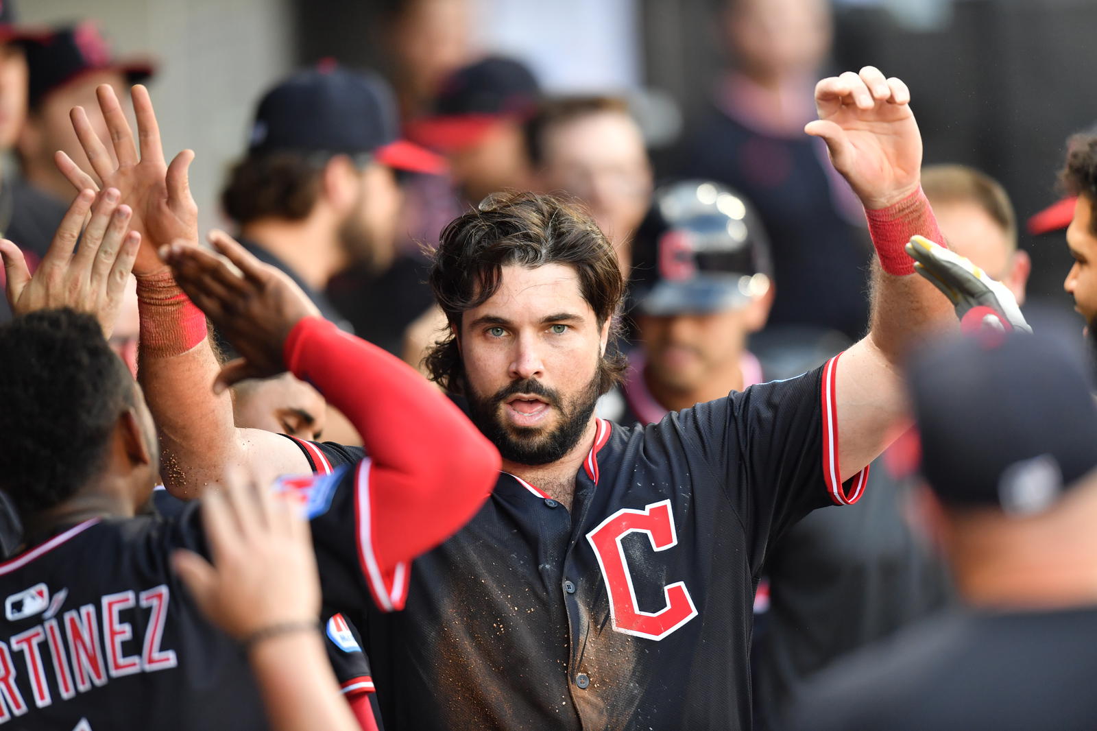 Jul 12, 2025; Chicago, Illinois, USA; Cleveland Guardians catcher Austin Hedges (27) celebrates with teammates in the dugout after scoring during the seventh inning against the Chicago White Sox at Rate Field. Mandatory Credit: Patrick Gorski-Imagn Images