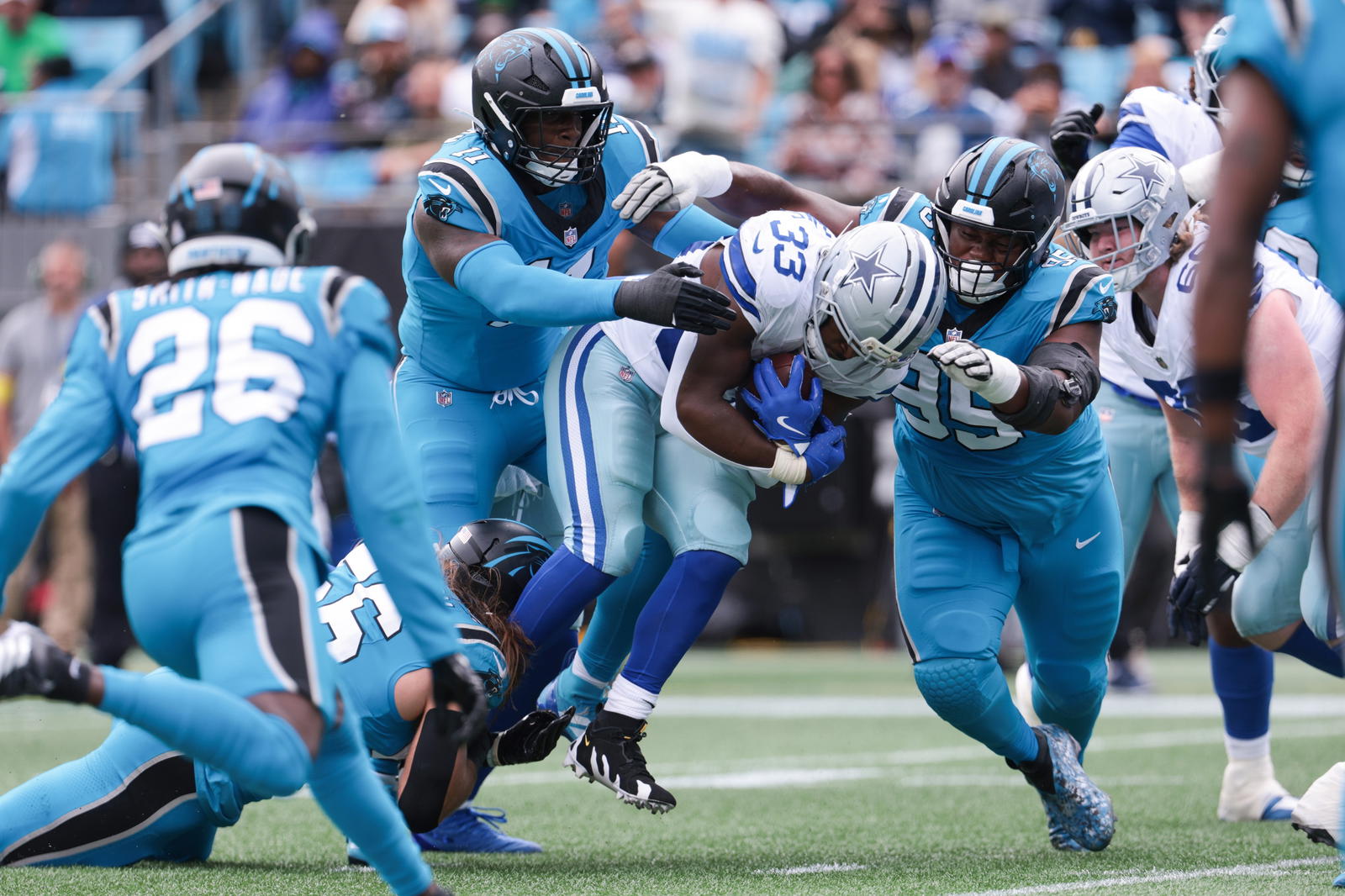 Carolina Panthers edge rusher Nic Scourton and defensive lineman Derrick Brown make a tackle. Credit:&nbsp;Scott Kinser-Imagn Images.