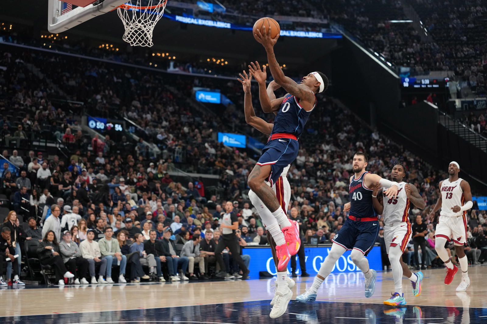 LA Clippers guard Bradley Beal (0) shoots the ball against Miami Heat forward Andrew Wiggins (22) in the first half at Intuit Dome.&nbsp;Kirby Lee-Imagn Images