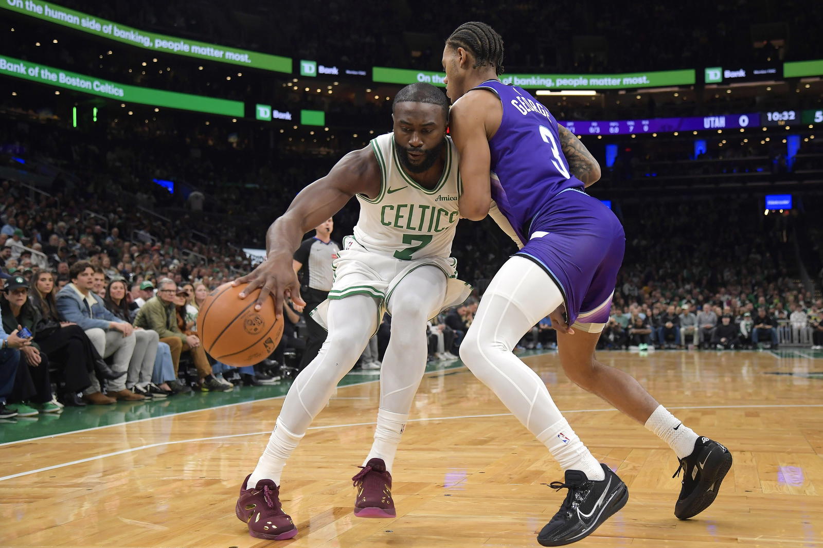 Nov 3, 2025; Boston, Massachusetts, USA; Boston Celtics guard Jaylen Brown (7) controls the ball while Utah Jazz guard Ace Bailey (19) defends during the first half at TD Garden. (Bob DeChiara/Imagn Images)