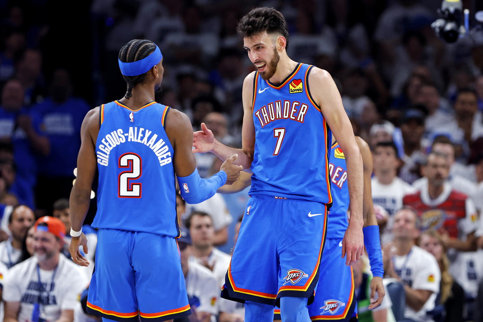 Oklahoma City Thunder forward Chet Holmgren (7) and guard Shai Gilgeous-Alexander (2) celebrates during the second quarter against the Minnesota Timberwolves in game five of the western conference finals for the 2025 NBA Playoffs at Paycom Center. Alonzo Adams-Imagn Images