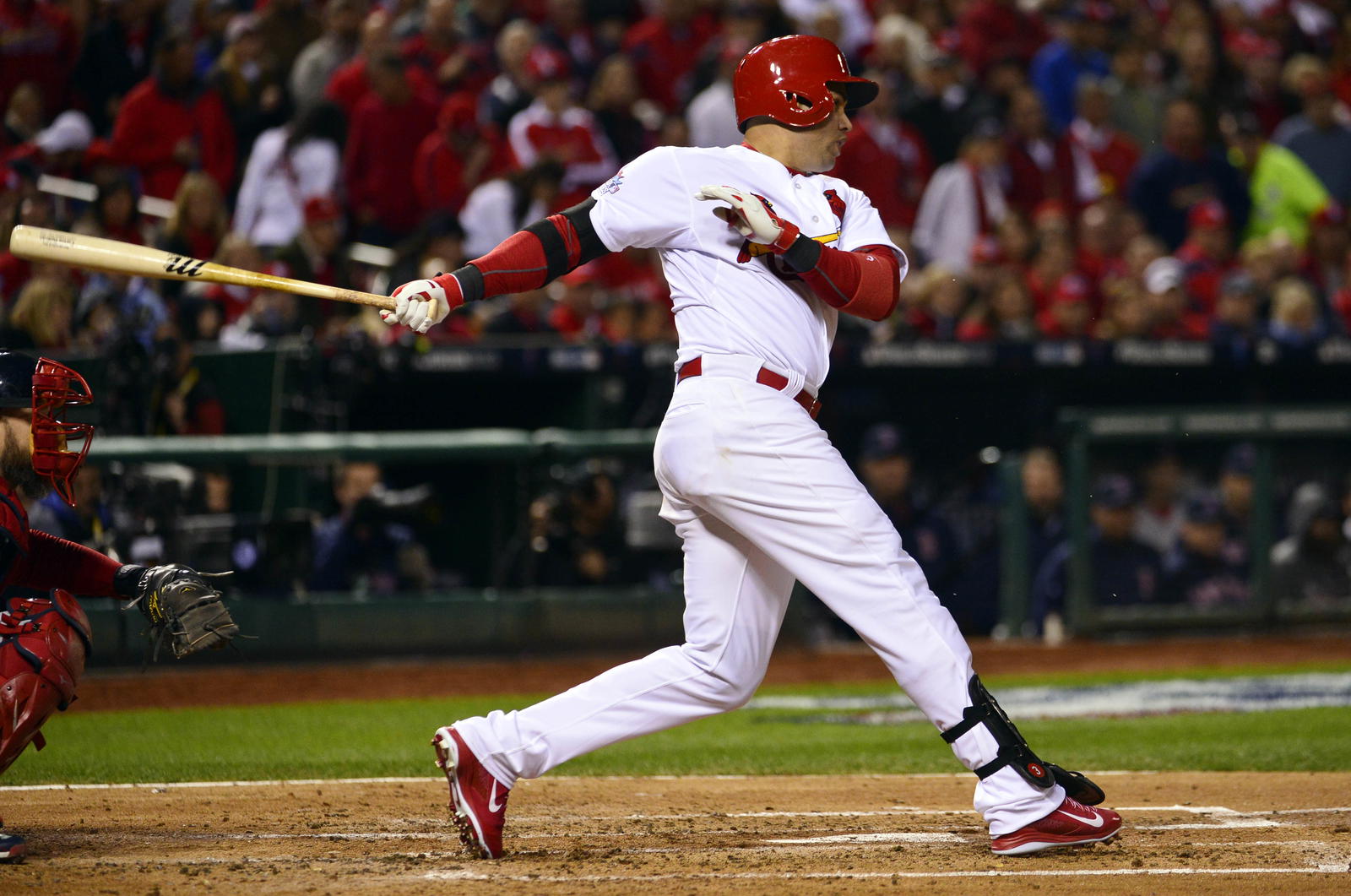 St. Louis Cardinals right fielder Carlos Beltran hits a RBI single against the Boston Red Sox in the third inning during game four of the MLB baseball World Series at Busch Stadium. Scott Rovak-Imagn Images