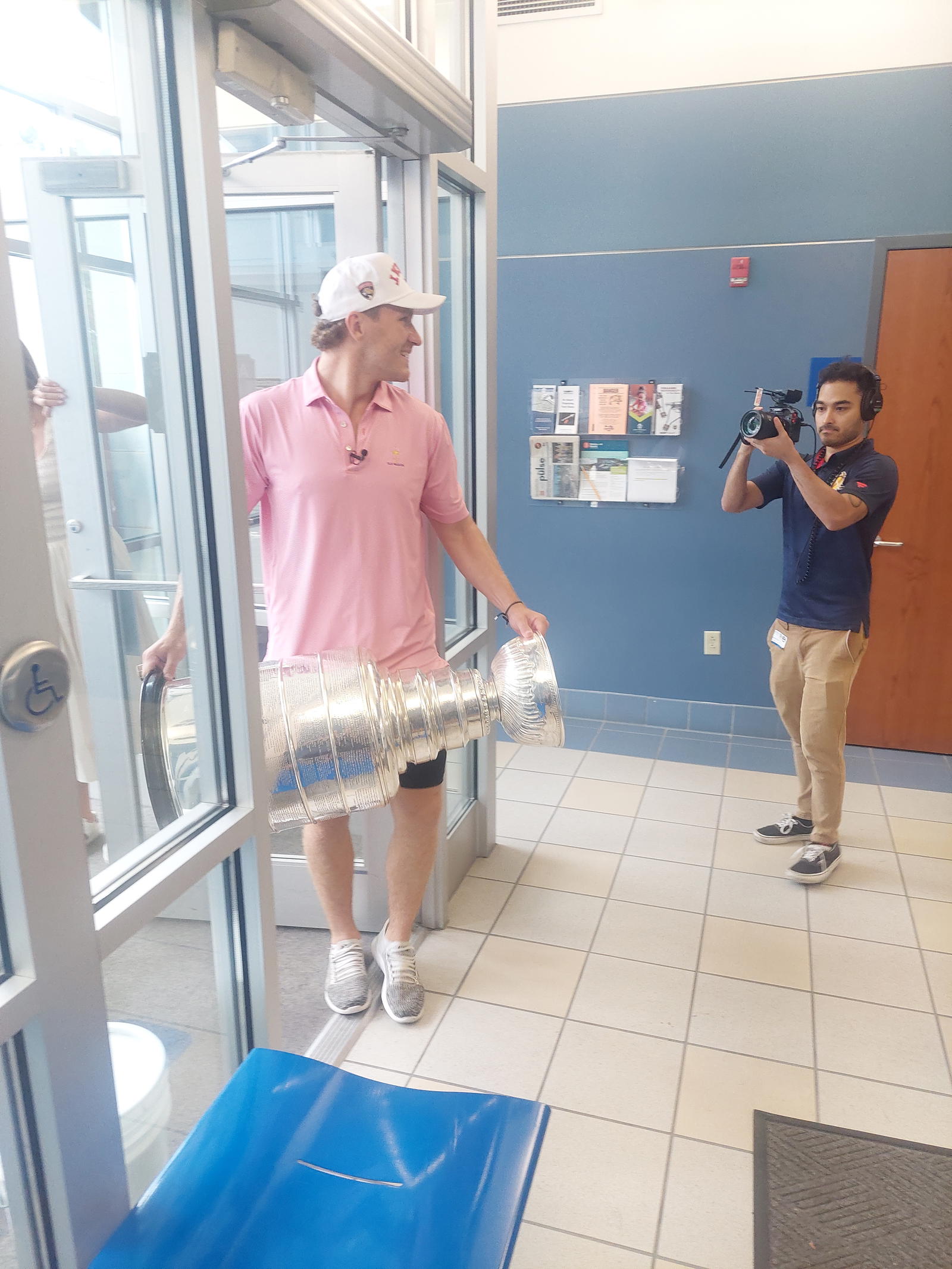 Florida Panthers forward and St. Louis-raised Matthew Tkachuk (left) enters the Brentwood Police Department on Monday on one of his stops on his day with the Stanley Cup.