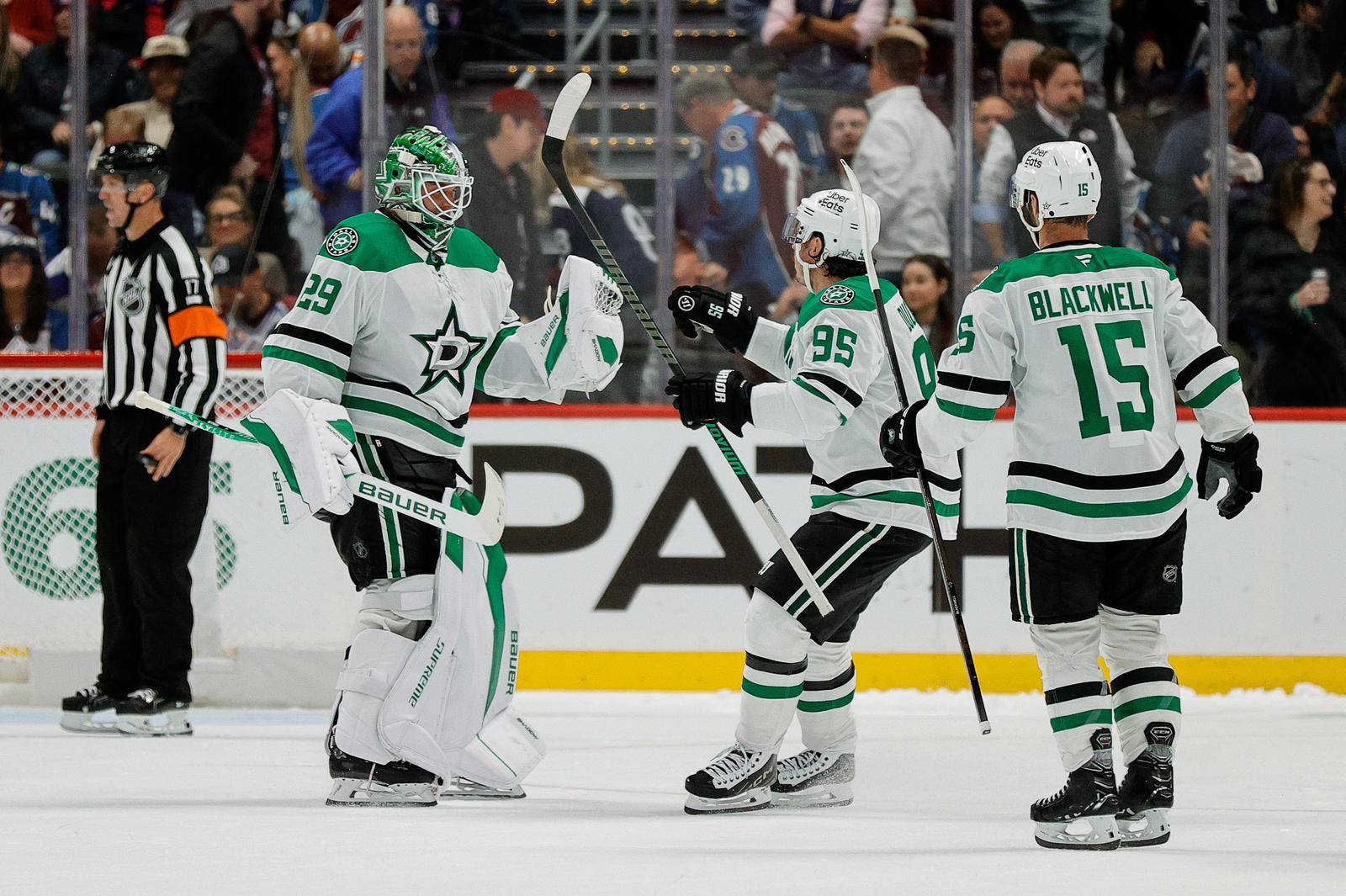 Dallas Stars goaltender Jake Oettinger (29) celebrates with center Matt Duchene (95) and center Colin Blackwell (15) after the game against the Colorado Avalanche at Ball Arena. Mandatory Credit: Isaiah J. Downing-Imagn Images