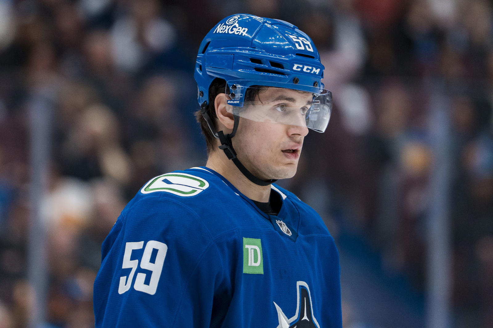 Apr 14, 2025; Vancouver, British Columbia, CAN; Vancouver Canucks defenseman Kirill Kudryavtsev (59) during a stop in play against the San Jose Sharks in the first period at Rogers Arena. Mandatory Credit: Bob Frid-Imagn Images