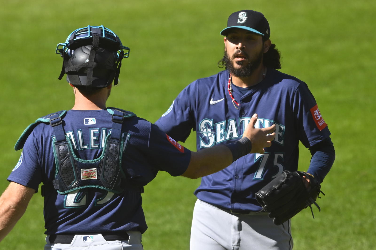 Seattle Mariners catcher Cal Raleigh (left) and reliever Andres Munoz celebrate a win over the Cleveland Guardians on Aug. 31 at Progressive Field. - David Richard/Imagn Images