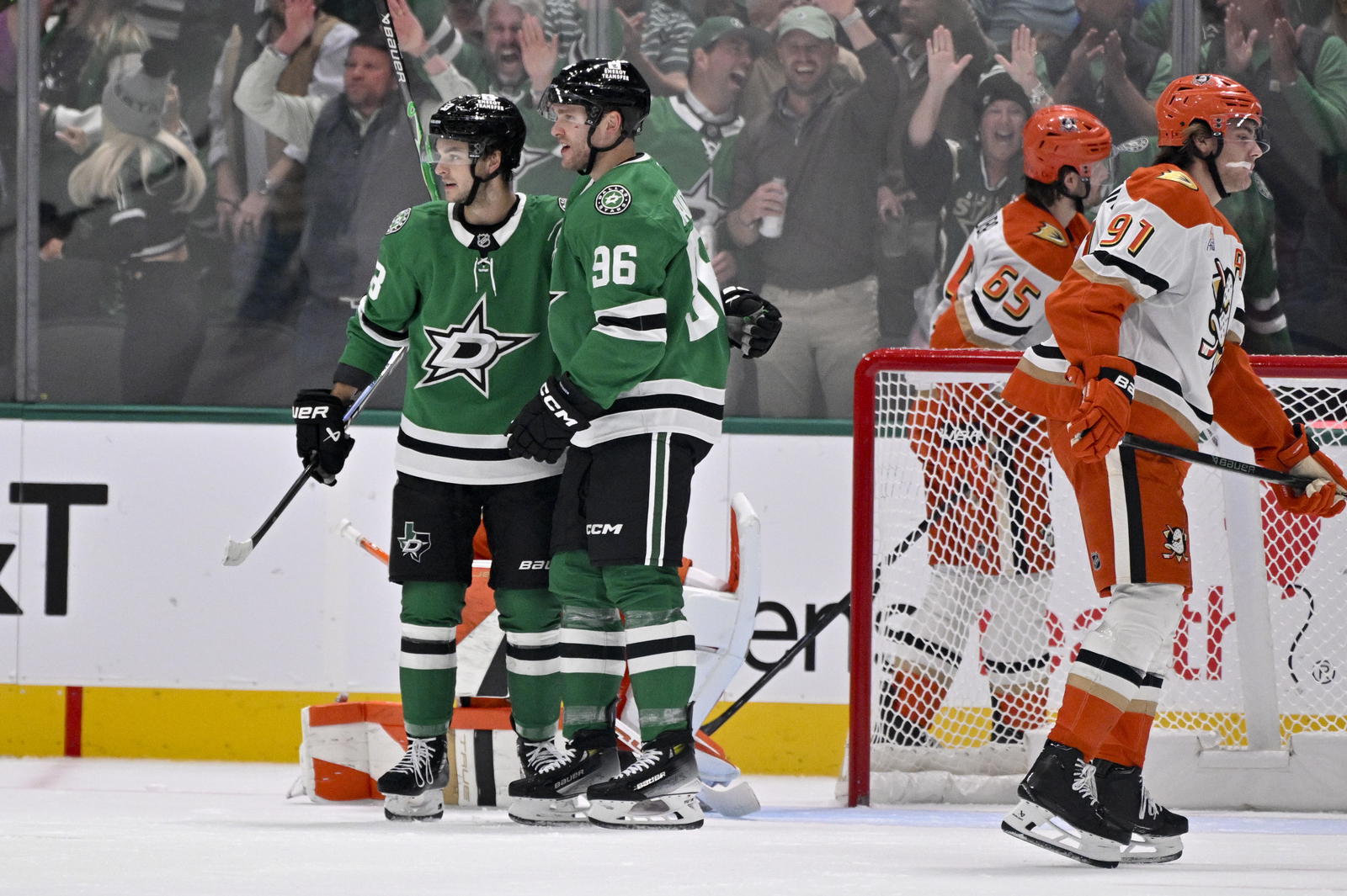 Dallas Stars center Wyatt Johnston (53) and right wing Mikko Rantanen (96) celebrate after Johnston scores a power play goal against the Anaheim Ducks during the first period at the American Airlines Center. Mandatory Credit: Jerome Miron-Imagn Images