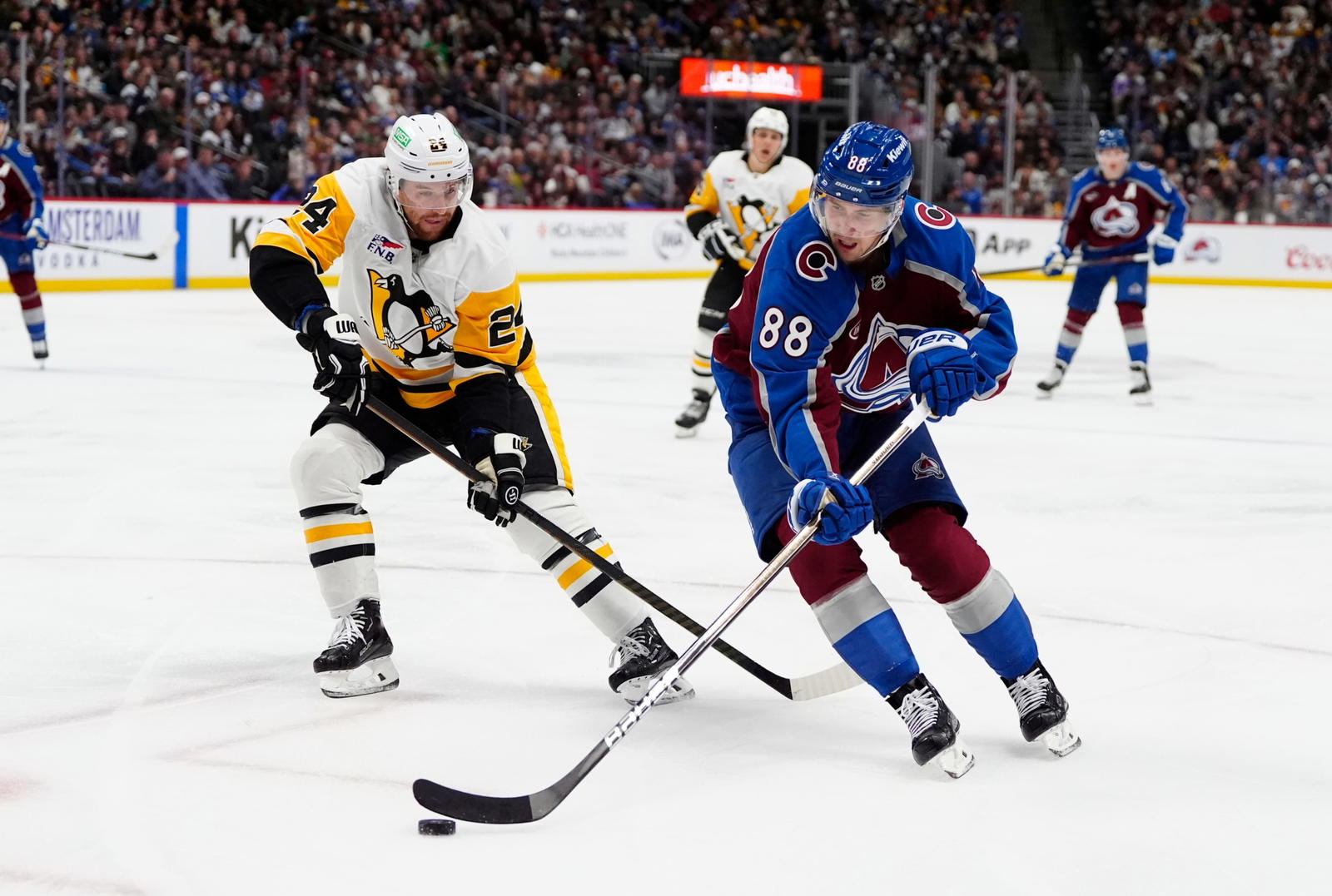 Mar 4, 2025; Denver, Colorado, USA; Pittsburgh Penguins defenseman Matt Grzelcyk (24) defends on Colorado Avalanche center Martin Necas (88) in the second period at Ball Arena. (Ron Chenoy-Imagn Images)